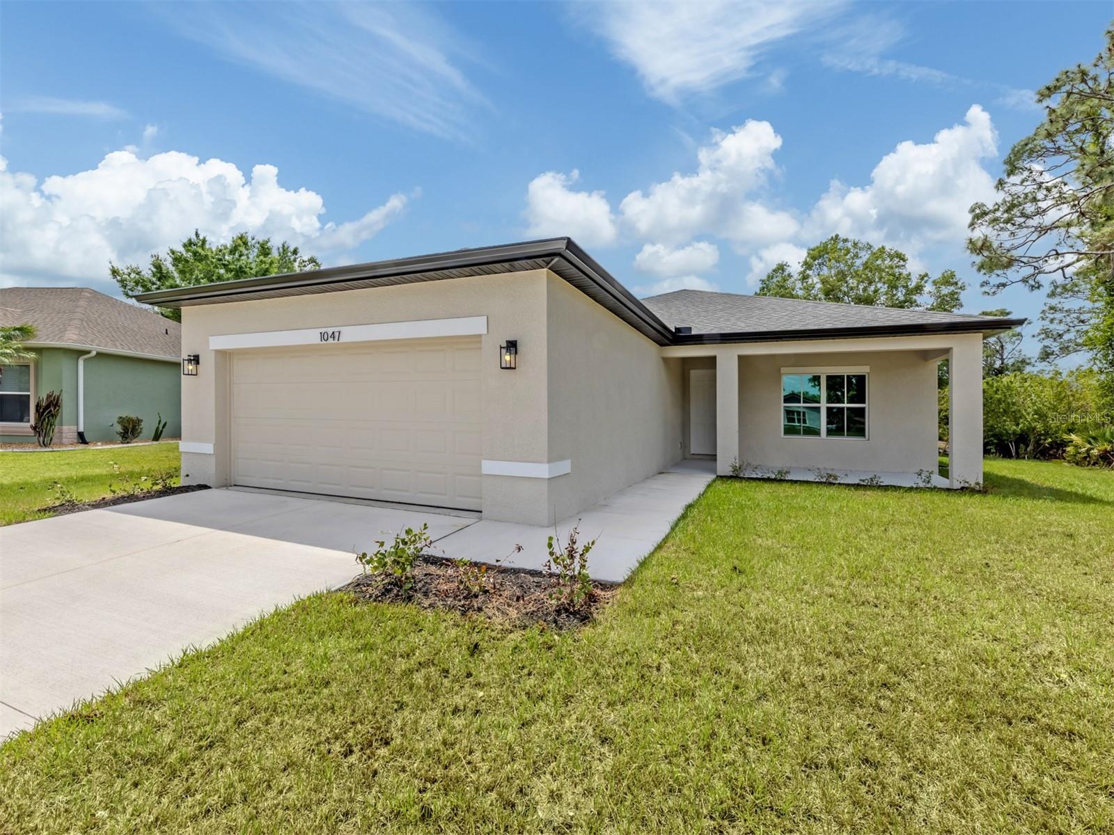 One or more photo(s) has been virtually staged. Some photos may be virtually staged. Modern comfort found in a great location in North Port. Welcome to this affordable new construction home with three bedrooms, two baths and an attached two-car garage, conveniently near shopping and local schools. The open design home awaits your decorating flair opportunities. Large sloping lot with mature trees for nice surroundings. Wellen Park community just minutes away, featuring the Atlanta Braves spring training ballpark which offers many additional events and concerts. Nearby attractions such as North Port Aquatic Center, Myakkahatchee Creek Environmental Park and Warm Mineral Springs. No HOA or CDD fees. Flood zone X to help with lower insurance costs.