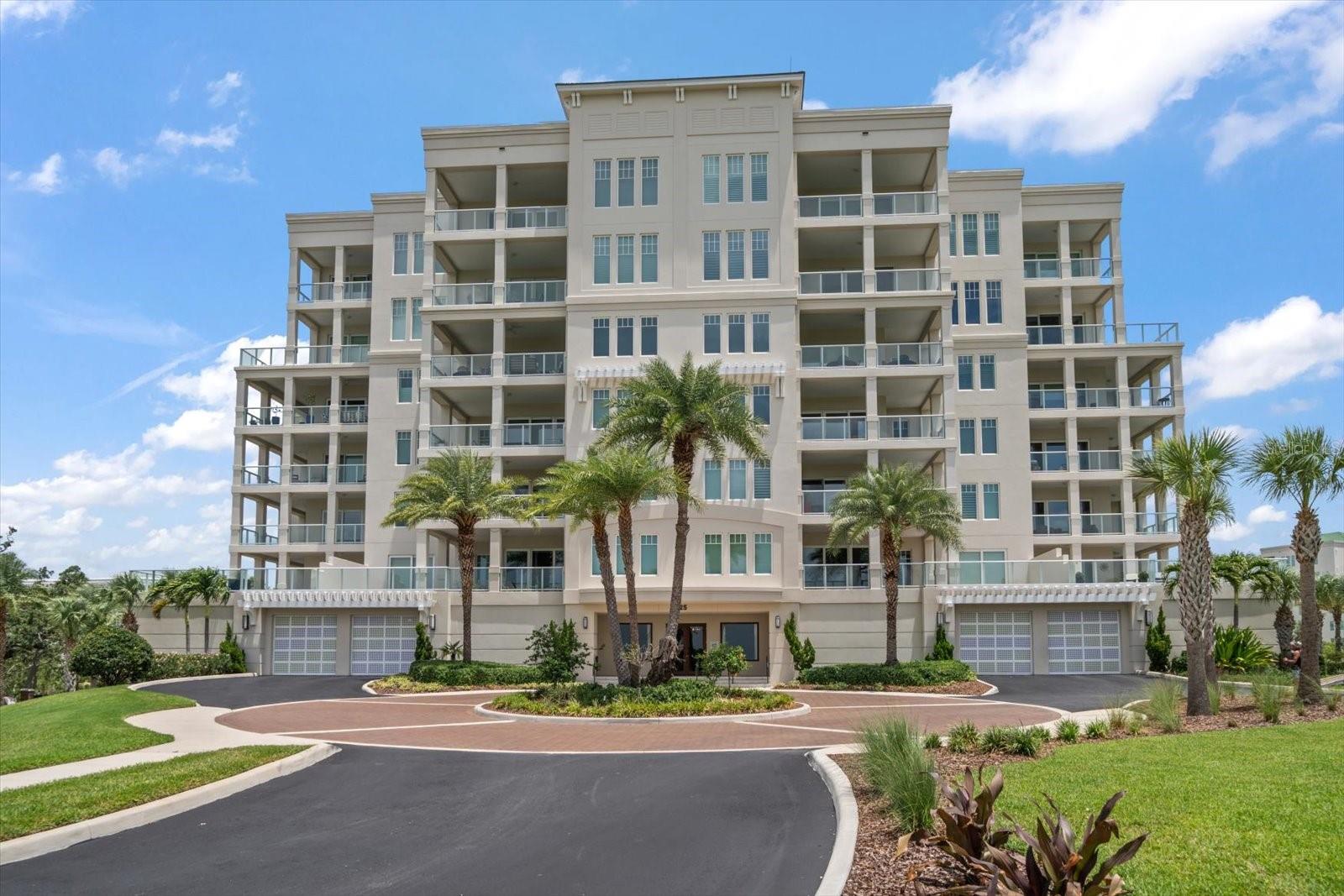 Behind the gates of the prestigious Belleair Country Club, within the elegant Residences at Belleview Place, a residence of timeless beauty and quiet sophistication awaits. From the moment you enter, the home unfolds like a scene from a classic European estate—striking formal rooms bathed in natural light where lush greens and soft ivory tones create an unforgettable backdrop of refined glamour. Rich dark trim, wide arched openings, and gleaming wood floors lend architectural drama and warmth, setting the stage for both gracious entertaining and peaceful everyday living. The living spaces flow effortlessly to a private wrap-around balcony where sweeping views of the golf course and the shimmering Intracoastal create a breathtaking setting for morning coffee or tranquil evenings beneath the Florida sky. The kitchen is equally impressive, offering generous counter space, elegant pendant lighting, stainless-steel appliances, and a gas cooktop, all complemented by an adjacent dining room adorned with stunning custom built-ins. The primary suite is a serene retreat filled with natural light and captivating views right from the bed, complete with two closets featuring custom built-ins. Its beautifully appointed ensuite bath includes a walk-in shower, separate water closet, and abundant storage. An additional bedroom and bath are thoughtfully designed to offer comfort and privacy for guests. Additional features of this home include a two-car garage and access to the historic Belleview Inn’s sparkling pool and fitness facilities. Rarely does a residence combine museum-quality detailing with such warmth and livability—an extraordinary opportunity to own a home rich in old-world charm and sophisticated design in one of Belleair’s most coveted settings.