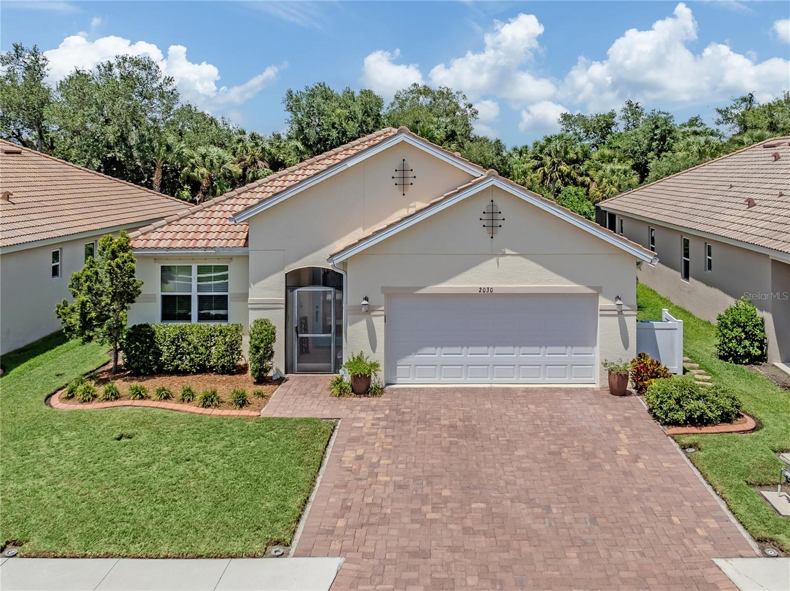 Why wait to build when you can move right into this beautifully upgraded 2,334-square-foot, 2019 KB Home, energy-efficient, pool home in the desirable Stoneybrook at Venice? Enter through the inviting custom glass front door into a bright foyer where you’re immediately greeted by tranquil preserve and sparkling pool views. This well-maintained, spacious split-bedroom floor plan is thoughtfully designed for modern family living and features custom tile throughout, four bedrooms, two full baths and a centrally located den with double glass door entry offering flexibility, privacy and comfortable separation of space; this home lives large. The open-concept kitchen features a large breakfast bar, granite countertops, solid wood cabinetry with soft-close drawers, a custom backsplash, a double-door pantry, a reverse osmosis system and abundant storage, all overlooking the dining area and great room. The great room is enhanced by tray ceilings and sliding glass doors that open to the lanai, seamlessly extending the living space outdoors to a 2022 heated saltwater pool with a clear-view screened enclosure overlooking the peaceful preserve. Privately at rear of the home, the spacious primary suite includes tray ceilings, a custom walk-in closet and a luxurious ensuite bath with dual sinks, granite countertops, solid wood cabinetry with soft-close drawers, a glass shower, a garden tub and a private water closet, creating a peaceful retreat. The split-bedroom layout places the three additional bedrooms toward the front of the home near the second full bath, which features dual sinks, solid wood cabinetry and a custom-tiled shower/tub combination. Additional highlights include a whole-house water softener, hurricane shutters for added peace of mind during storms, extra storage closets, a widened paver driveway, a laundry room with additional cabinetry and a two-car garage with extra storage space and a new garage door installed in 2025. Residents of Stoneybrook of Venice enjoy resort-style amenities including a guarded gate, clubhouse, fitness center, movie room, gathering room with kitchen, resort-style pool (currently being refinished), hot tub, splash pool and splash park, playground, sand volleyball, tennis courts, ball fields and pickleball courts. Conveniently near Interstate 75, downtown Venice, Sarasota Memorial Hospital, shopping, dining, Gulf beaches, A-rated schools and the Atlanta Braves spring training ballpark this move-in-ready home offers a blend of luxury, comfort and Florida lifestyle living.