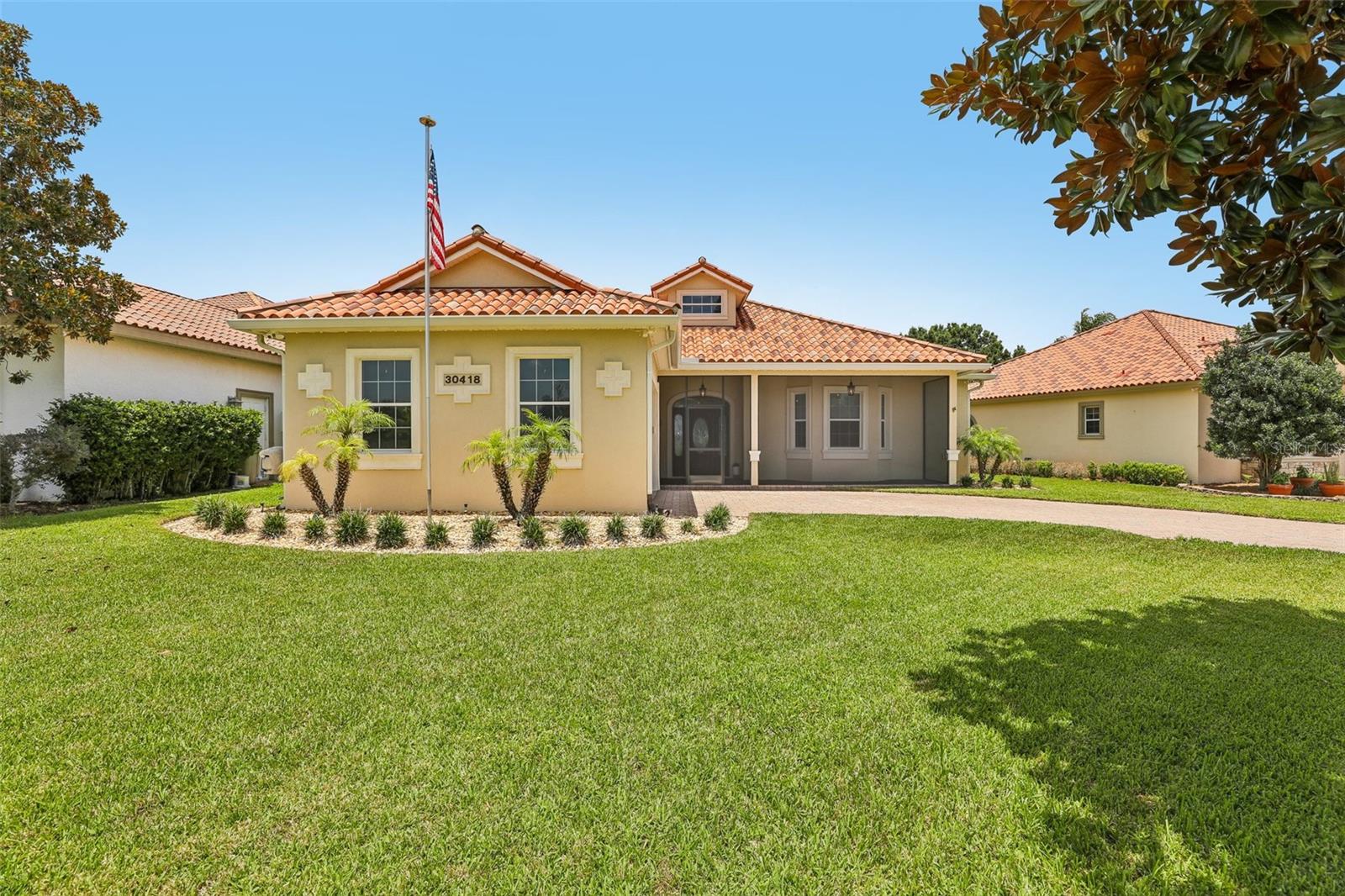 Stunning Golf Course and Lake Views in the Exclusive Deer Island Club Community.  Discover refined island living at its finest in this beautifully upgraded home on Deer Island — a secluded 400-acre paradise nestled within Florida’s renowned Harris Chain of Lakes. Offering sweeping views across the fairways of Deer Island Country Club golf course and Lake Beauclair, this residence sits in a private setting with no rear neighbors. Its unique positioning allows you to enjoy both breathtaking sunrises over the lake and vibrant sunsets across the golf course.
The current owners have thoughtfully enhanced the home, creating a true move-in-ready gem. Inside, you’ll find a spacious split-bedroom layout with high ceilings and an open floor plan that feels bright and airy. Ceiling fans throughout add comfort, while a versatile bonus/flex room — currently used as a gym — offers flexible options as a home office, guest space, or additional living area.
Recent upgrades include elegant chair rails, fresh interior and exterior paint, new engineered wood flooring, and a fully remodelled primary bath featuring a custom walk-in closet. All electrical switches, outlets, lights, fans and smoke detectors have been replaced, in addition to the highest quality switch & outlet plate covers. The great room has a freestanding electric fireplace, that the owners will be leaving. The tile roof has been professionally inspected and cleaned, water heater (2022), and the A/C system carries a transferable warranty through 2029 (with all ducts recently cleaned and the blower replaced).
Outside, a generous driveway accommodates up to four cars and leads to the two-car garage. A screened front porch provides the perfect spot to enjoy morning coffee while watching the sunrise over Lake Beauclair. At the rear, stacking sliders open to a large screened porch overlooking the 8th fairway — an ideal space for entertaining or simply soaking in the views. The home also features modern blinds throughout, with automated electrical blinds on the great room sliders. The irrigation system has been recently upgraded with all-new sprinkler heads.  Deer Island Country Club is home to Central Florida’s only island golf course—a semi-private, 18-hole championship layout designed by the legendary architect Joe Lee and opened in 1994. This unique course winds through environmentally protected wetlands with Joe Lee’s signature style: undulating greens, strategically placed visible hazards, distinctive finger-style bunkers, and multiple water features that challenge yet delight golfers of all levels.  Beyond golf, the club offers superb amenities, dining at The 19th Wave, and a welcoming community atmosphere focused on the island lifestyle.