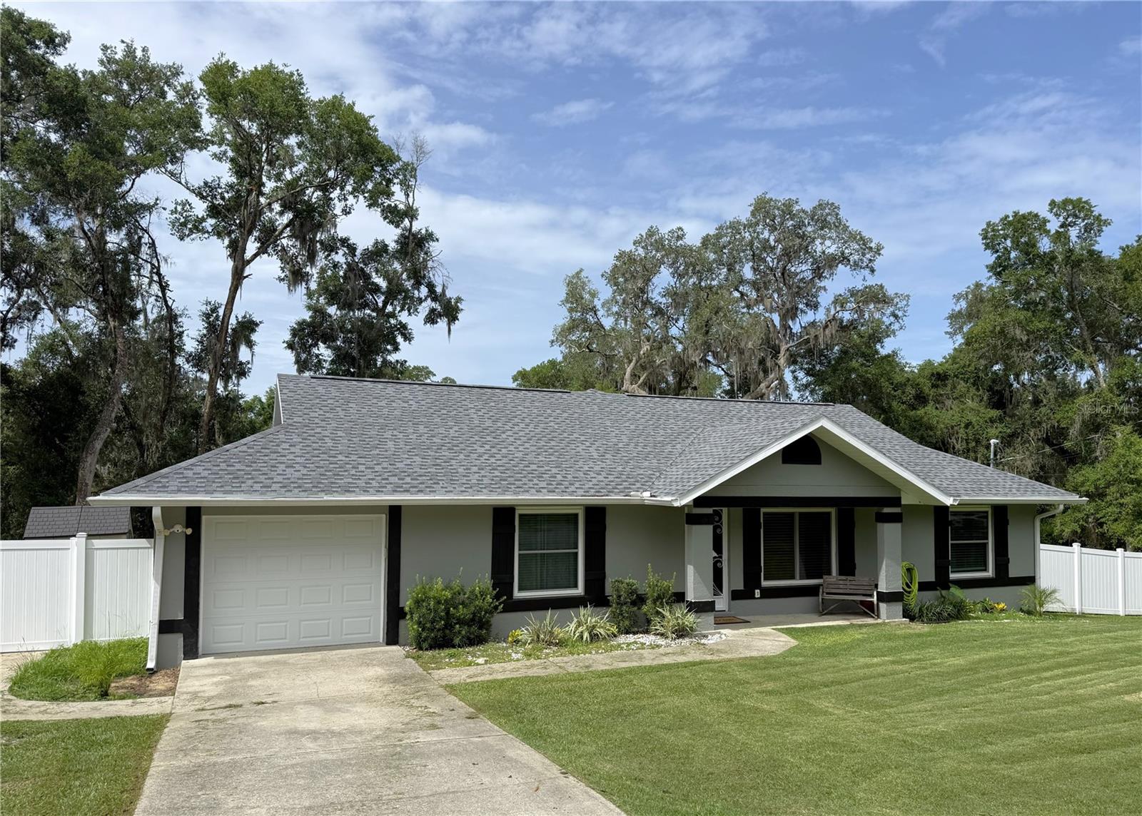 Move-in ready and loaded with updates! This beautifully maintained 3-bedroom, 2-bath home offers 1,412 square feet of comfortable living space on a rare 0.47 acre double lot. Featuring an inviting flowing floor plan with a desirable split-bedroom layout, this home is designed for both everyday living and entertaining.
French doors open to a large covered porch, creating the perfect space to relax or host family and friends. The primary suite includes a bath with a walk-in tiled shower, and the convenient inside laundry room adds to the home's functionality. Recent improvements provide peace of mind, including a new roof (2025), new luxury vinyl plank flooring throughout (2025), all new windows (2022), new electrical panel with exterior sub-panel pre-wired for a pool and generator, Insta-Hot water heater (2020), water softener (2020), and a fresh interior-exterior paint job (2026).