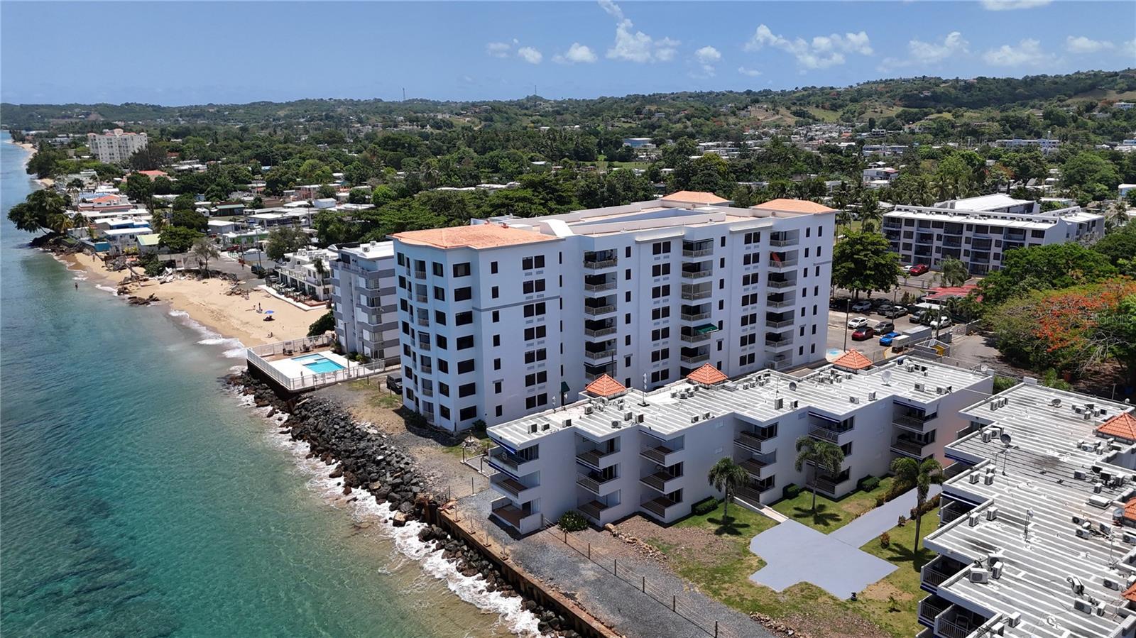 Wake up to the sound of the waves in this oceanfront 2-bedroom, 2-bathroom condominium at Victoria del Mar in Rincón. Located on the first floor, this approximately 1,132-square-foot residence offers breathtaking ocean views from the main living areas and private balcony. Sold fully furnished and including appliances, the unit features an open-concept layout, a laundry room, assigned parking, and controlled access. Short-term rentals are permitted, making it ideal as a primary residence, vacation home, or investment property.