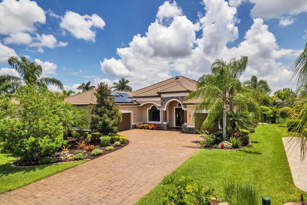 Urgent relocation. Need to sell immediately!. Recent $855,000 appraisal and inspection reports available.  Small gated community.  20 kW solar home with solar water heater and 3 Tesla Powerwall batteries (no debt). Miami-Dade high impact windows and doors. Freshly painted, tile roof, cleaned gutters.   ALL THROUGHOUT: Porcelain tile on diagonal, plantation shutters, 10' ceilings w/ crown molding. Arlo security system with doorbell and 6 cameras. Fenced/hedged back for pets and privacy. Whole house dehumidifier. High efficiency, variable speed A/C unit with 3 zone comfort, UV purification, 2023. Water softener, carbon filter, UV water purification, and R/O system (kitchen). Private irrigation well. Sola Tubes for energy free natural lighting - kitchen, hall, laundry. Great room boasts a coffered ceiling, leather seating, 77" Samsung, Sonos Gen2 soundbar and woofer, built-in cabinetry for electronics and dry bar. Kitchen remodeled 2021with solid wood cabinetry - 42" x 15" uppers, 8 large pull-out drawers, Cambria quartz tops, elite appliances. Huge walk-in pantry. Office has 2 work- stations and custom built-in generous storage space. Primary bedroom has king adjustable bed, 55" TV. Master bath with massive storage closet, dual sinks, walk-in shower, and private WC.  Tub/shower combo in guest bath, and frameless shower in pool bath. Laundry with W/D, large sink, utility nook and 2nd refrigerator. 2/1 split garages, mini-split in workshop/garage, polyaspartic flooring and stunning amount of storage areas in both.. Lanai has polyaspartic flooring, panoramic cage, outdoor kitchen with granite, new refrigerator and fans, snack bar, seating group around fire pit table. Salt pool pump and chlorinator replaced 2025. Extensive landscaping with curbing, many path and up lights, rubber mulch, high grade artificial turf in back, private irrigation well, 2 pavered patios and walkways. 4 large cantilever umbrellas. TURNKEY: All furniture, large and small appliances, housewares,  linens, cleaning and paper products, shop vac, yard tools and necessities, power turf sweeper, and most decor. No CDD fees. Home insurance $2675, electric $31/month (FPL fee), HOA fee $150/month.