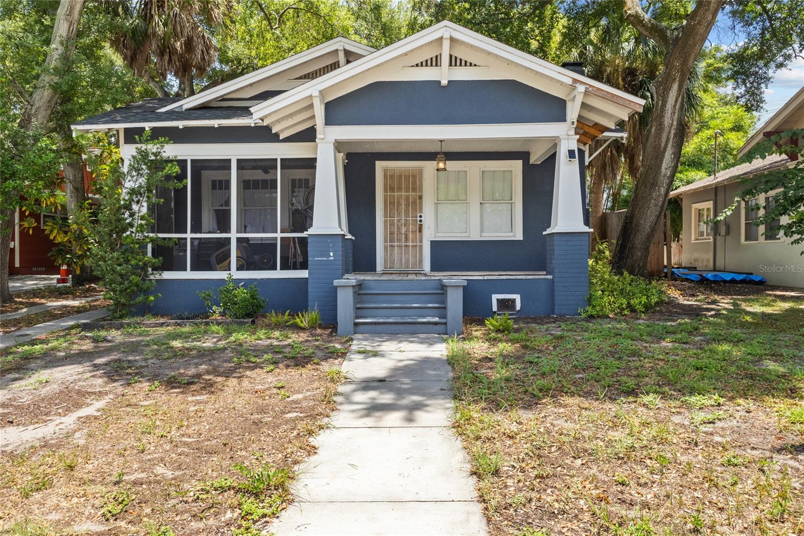 **MULTIPLE OFFERS - HIGHEST AND BEST DUE BY 12PM ON TUESDAY, 7/21** Some homes are all about how they look. Others focus on the lifestyle they offer. This one offers both! Located just a couple of blocks from the Gulf waters and situated in an X FLOOD ZONE, this charming Clearwater home puts you close to everything you love while offering added peace of mind. Ask the seller what first drew her to this home, and she'll tell you it was the LOCATION. From here, you're just minutes from the Pinellas Trail, vibrant Downtown Dunedin, Coachman Park, waterfront dining, shopping, & everything that makes this part of Florida so desirable. Whether you enjoy biking, boating, festivals, or sunsets by the water, you'll appreciate having it all within easy reach. Inside, the home's character is immediately evident. Built-in shelving beautifully frames the wood-burning fireplace, creating a warm & inviting focal point in the living room. On the other side of the living room, you'll find a library ladder leading to a storage loft area...a charming detail that adds even more personality to the home. Natural light fills the home, while the gorgeous, FULLY REMODELED KITCHEN (2019) blends style and function with a GAS RANGE, FARMHOUSE SINK, and updated finishes that make it the heart of the home. Other major improvements provide added value, including a NEW ROOF IN 2024, a TANKLESS WATER HEATER INSTALLED IN 2019, & EXTERIOR PAINTED IN 2020. Step outside and discover what may become your favorite place to spend time! THE PRIVACY-FENCED BACKYARD IS TRULY PARK-LIKE, featuring mature trees, lush landscaping, & 2 separate patios, creating a peaceful setting that's perfect for entertaining, gardening, enjoying your morning coffee, or simply relaxing at the end of the day. In addition to the backyard, you'll also enjoy the screened-in lanai at the front of the home, along with the covered porch as you walk up to the front door. The seller has priced this home with opportunity in mind. Estimated repairs are less than $15,000, with a quote available for the foundation pier work on the north side of the home. This presents a great opportunity to complete a few improvements, add your personal touches, and create a home that reflects your style without paying top dollar for someone else's updates. This is an amazing opportunity to own a home with timeless character, meaningful updates, an incredible backyard, & an exceptional location just blocks from the water...all while enjoying the benefits of being in an X Flood Zone!
