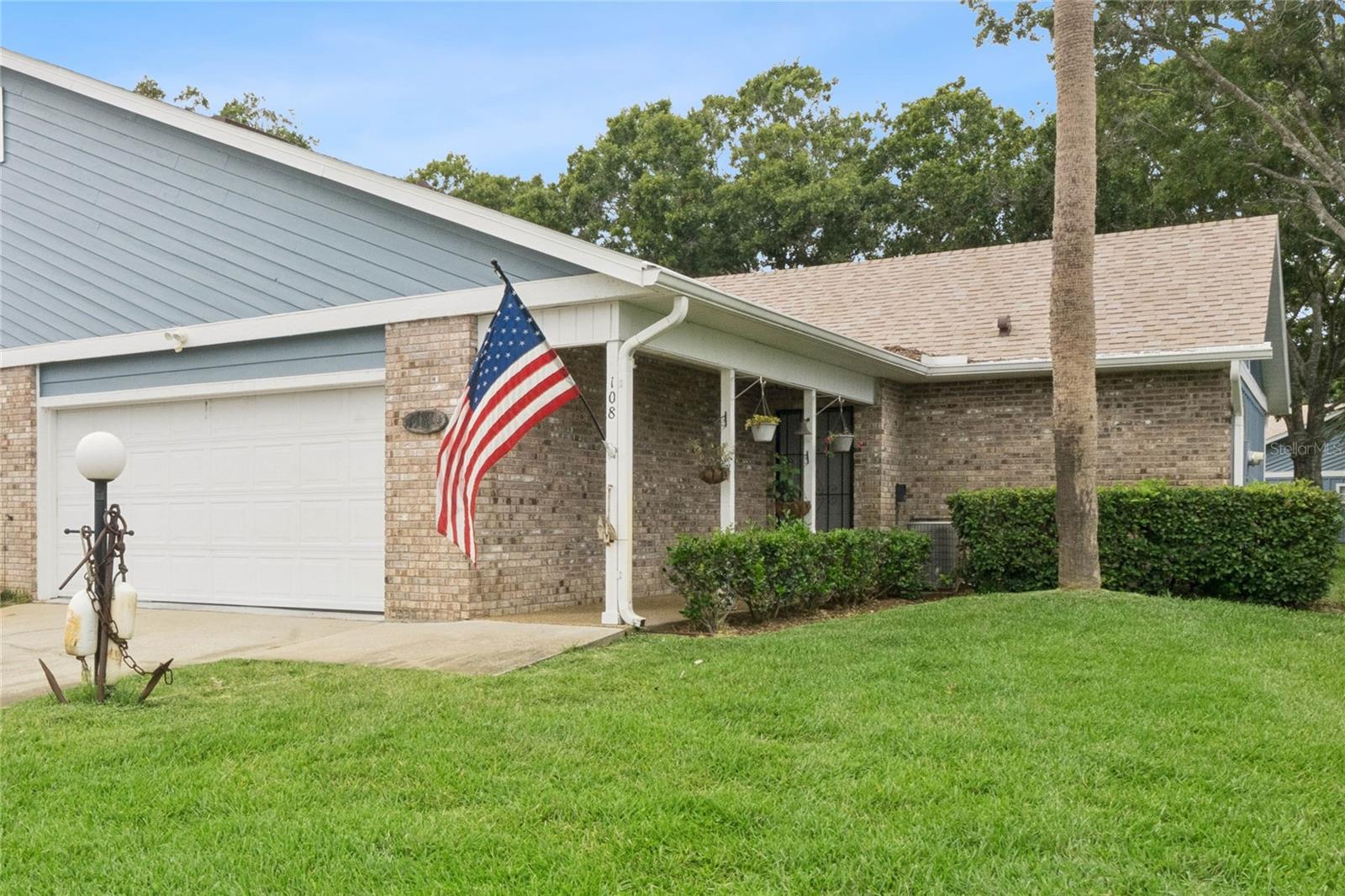 Beautifully updated and move-in ready, this Westgate Condo in Pelican Bay offers comfort, style, and low-maintenance living. This 2-bedroom, 2-bath condo features a new roof, vaulted ceilings, skylights, tile flooring throughout, and a spacious open floor plan designed for comfortable Florida living. The updated kitchen showcases granite countertops, stainless steel appliances, custom cabinetry with glass-front display cabinets, a tile backsplash, breakfast bar seating, and abundant storage. The bright living and dining areas flow seamlessly into the enclosed Florida room, providing additional year-round living space. The primary suite offers generous closet space and a private bath, while both updated bathrooms feature beautiful floor-to-ceiling tile for a clean, modern look. Additional features include recessed lighting, updated fixtures, and a private driveway. Furniture is negotiable, making this an excellent opportunity for a primary residence, seasonal retreat, or investment. Enjoy low-maintenance living with 24-hour gated security, optional golf memberships, and convenient access to shopping, dining, hospitals, Embry-Riddle Aeronautical University, Daytona State College, Daytona International Airport, I-95, and the area's beautiful beaches. Move-in ready and ideally located in one of Daytona Beach's most desirable gated communities. Call today to view this one in person!