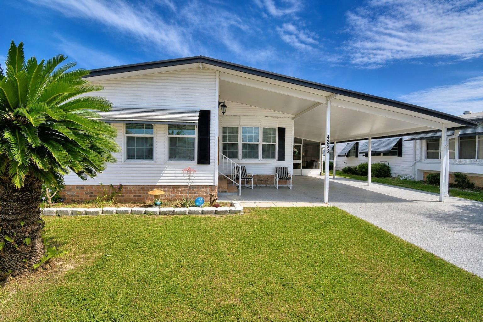 Move right into this fully furnished home.  This home offers lots of space with walk in closets in both bedrooms and a new vanity in the primary bathroom.  Plus the lanai offers extra living space as well as the bonus room on the front of the home.  The refrigerator and washer and dryer are newer. The metal roof was installed in 2024.  Oakwood Estates, a 55+ community, offers many activities and amenities, so you can be as busy as you would like, or just sit back and enjoy the peaceful community.  The rocker recliner in the living room and TVs do not convey.