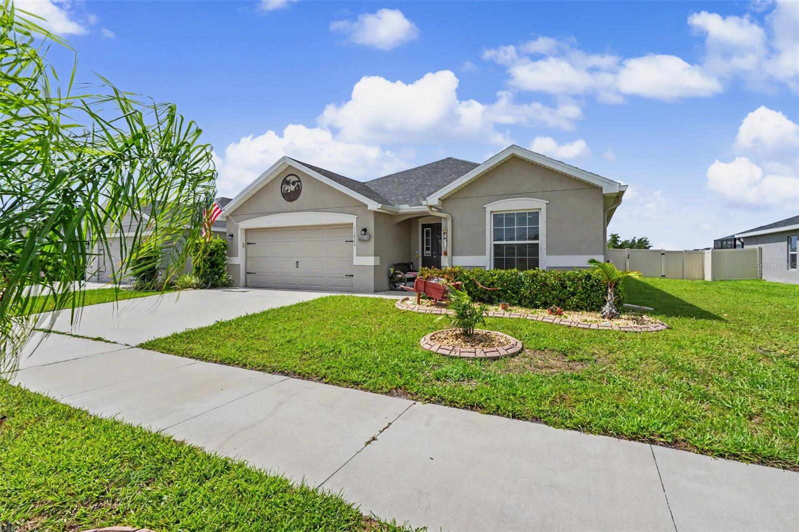Beautiful Move-In Ready Single-Story Home Built in 2022 | 3 Bedrooms + a FLEX room that can easily be converted to a 4th bedroom.
Designed with both style and functionality in mind, this open split-bedroom floor plan features luxury vinyl plank flooring throughout (with the exception of one walk-in closet) and elegant PLANTATION shutters in the bedrooms. As you enter the inviting foyer, you'll find the flex room with French doors to your right, followed by two spacious secondary bedrooms that share a full bathroom.
The heart of the home is the expansive kitchen, which seamlessly opens to the family and dining areas beneath a stunning 13-foot vaulted ceiling. Perfect for entertaining, the chef-inspired kitchen boasts a large center island, stainless steel appliances, abundant cabinetry with convenient pull-out lower drawers, generous counter space, and a spacious walk-in pantry.
The private primary suite overlooks the fully FENCED in backyard and features tray ceilings, plantation shutters, and a luxurious en-suite bathroom complete with a walk-in shower, water closet, additional cabinetry, and custom CALIFORNIA CABINET systems for both his and hers walk-in closets. Conveniently located just off the kitchen, the laundry room includes front-loading washer and dryer on pedestals along with built-in workstation cabinetry. The garage offers PULL-DOWN attic stairs, providing easy access to additional storage space.
Step outside and enjoy Florida living at its best in the screened lanai, which opens to an additional screened outdoor area overlooking the fully fenced backyard—ideal for relaxing, entertaining, or pets.
Additional upgrades include:
Whole-home water purification system (2022). Reverse osmosis drinking water system in the kitchen. Hurricane shutters included. Custom California Closet systems. Plantation shutters. Luxury vinyl flooring throughout most of the home
Located in the desirable Ridgewood community, residents enjoy resort-style amenities including a zero-entry swimming pool and covered playground. The home is conveniently situated near shopping, dining, highly rated schools, and offers quick access to I-75 and major roadways, making commuting a breeze.
This exceptional home combines modern upgrades, thoughtful design, and an unbeatable location—ready for you to move in and enjoy!
