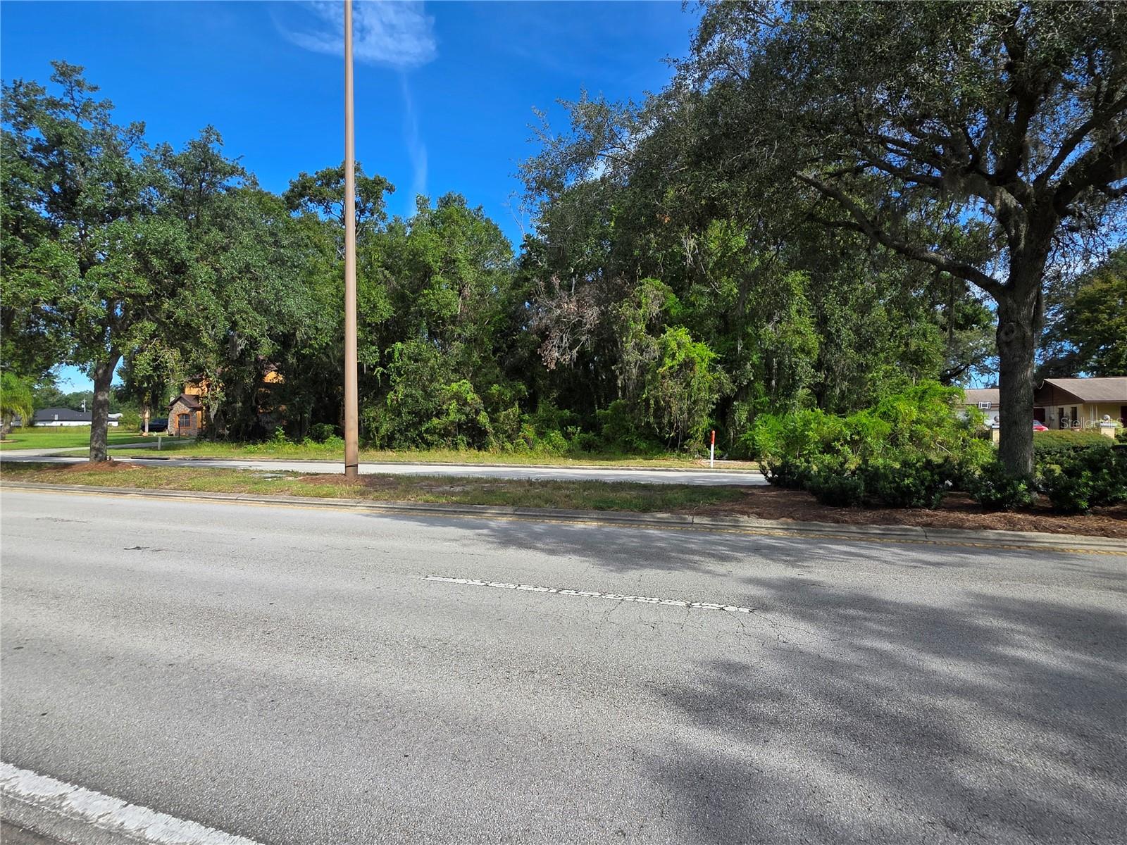 This exceptional residential lot offers a fantastic opportunity to build in one of the most convenient locations near The Villages. Situated off Highway 42, directly across from The Villages Mulberry shopping area and just down the road from the Veterans Administration Clinic, this property provides unparalleled access to shopping, healthcare, dining, banking, and entertainment options. The proximity to The Villages amenities makes this an ideal spot for those seeking a vibrant, active lifestyle. Located in the family-friendly Orange Blossom Hills neighborhood, this lot measures 75 feet by 125 feet and is zoned residential, offering ample space for your new home or investment. With no HOA fees or bond obligations, you have the flexibility to create your ideal residence without restrictions. The church and Walgreens are within walking distance, adding convenience for everyday needs. Nearby amenities include Lake Weir for boating and fishing, perfect for outdoor enthusiasts. Central Florida’s diverse recreational opportunities are also within easy reach—enjoy sunset watching, horseback riding, mountain biking, pickleball, and yoga. This location’s perfect blend of convenience, outdoor activities, and community amenities makes it a truly outstanding opportunity. Don’t miss your chance to own a piece of this thriving area in Marion County, Florida. Parcel ID information is available upon request.