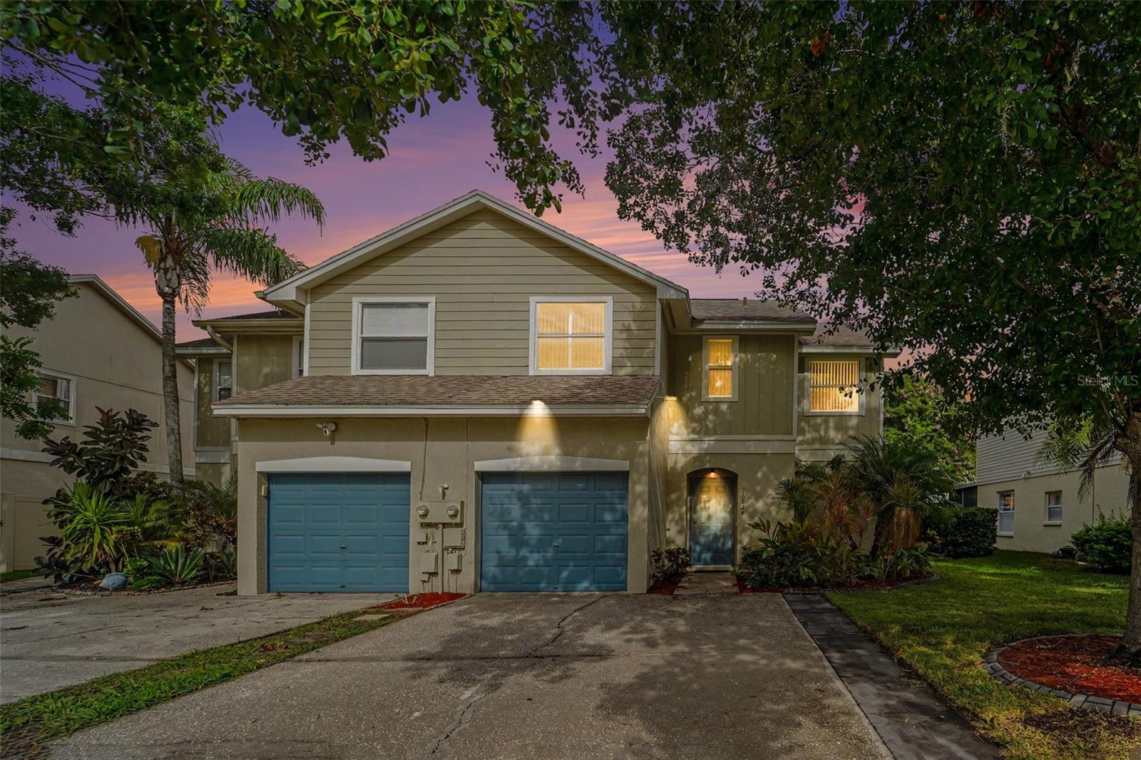 Welcome to this well-maintained home in the quiet and desirable Le Clare Shores community. This move-in ready property features classic upgrades such as: wood floors throughout the entire first floor; A large kitchen with new Samsung stainless steel appliances and a big island; Newer carpet on the stairs and all bedrooms upstairs; Newer waterproof tile flooring in both bathrooms upstairs and a fully remodeled guest bathroom tub and shower.  Major improvements include a newer A/C system, newer roof, and newer fencing for added peace of mind, as well as minor improvements including the beautiful barn door. This townhome is in the highly sought after Northdale area of north Tampa, close to shopping, several golf courses, the Veteran's Expressway and only 10 miles from Tampa International Airport, and is fiber internet ready. 
The fence along all of the backyard of the property provides privacy and low-maintenance appeal. Enjoy the charm of a peaceful lake community with access to the neighborhood amenities, such as pool, playground, boat ramp, private lake, and dock, all along a serene setting. This is a wonderful opportunity to own a well-cared-for home in a convenient Tampa location.