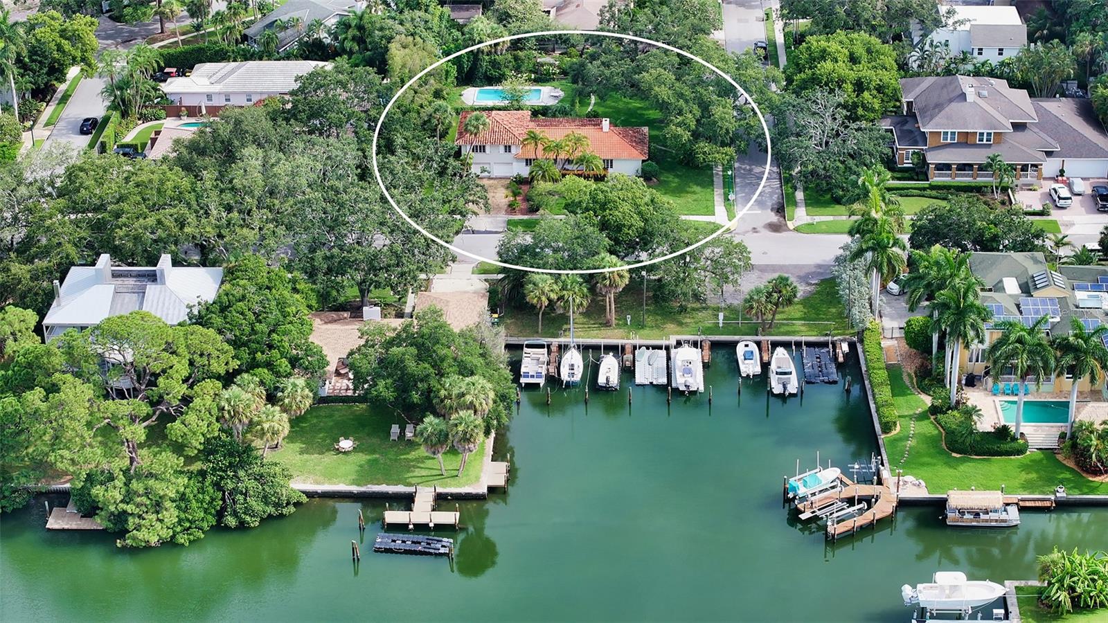 The most sought-after location West of Trail. Situated in the Bay Point neighborhood, this home was originally built in 1949 by the grandfather of the current owners, using the finest quality materials of the time. The exterior walls are clay and the roof clay tile. The home is also built above ground elevation. This 3-bedroom, 2-bathroom pool home exudes character and old-world charm. Notable features include high ceilings, oversized living room with fireplace, enclosed lanai, beautiful condition oak hardwood floors, plaster walls, a split floor plan, a spacious attached 2 car garage, and an extraordinary yard. Located on a prized oversized corner lot, 135x151, overlooking the community marina. The property is in original condition, presenting a great opportunity to restore it or build a new custom home. The Bay Point neighborhood offers its own community dock. It is just a short walk to the downtown Sarasota Bayfront, Southside Village, and Marie Selby Gardens, and is easily accessible to the world-famous beaches of Lido and Siesta Key, as well as the city's dining and shopping options.