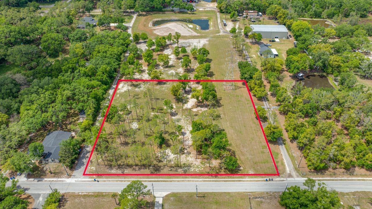 Beautiful, ready to build lots available in the highly desired town of Lutz. This exceptional property offers the perfect blend of peaceful airy pines, rural living with convenient access to urban amenities. Build your dream country estate on this 2.68 acre lot. Commute is close to I-275, I-75 and the Veterans Expressway. Property like this is hard to find with No HOA or CDD fees. The adjacent 2.52 acres lot is available as well if you are looking for a larger lot of approximately 5.2 acres. This lot has a 20’ ingress/egress on SE corner for driveway access to Lot 2(separate listing). There is also a 100’ Florida Powerline easement on North side of property.