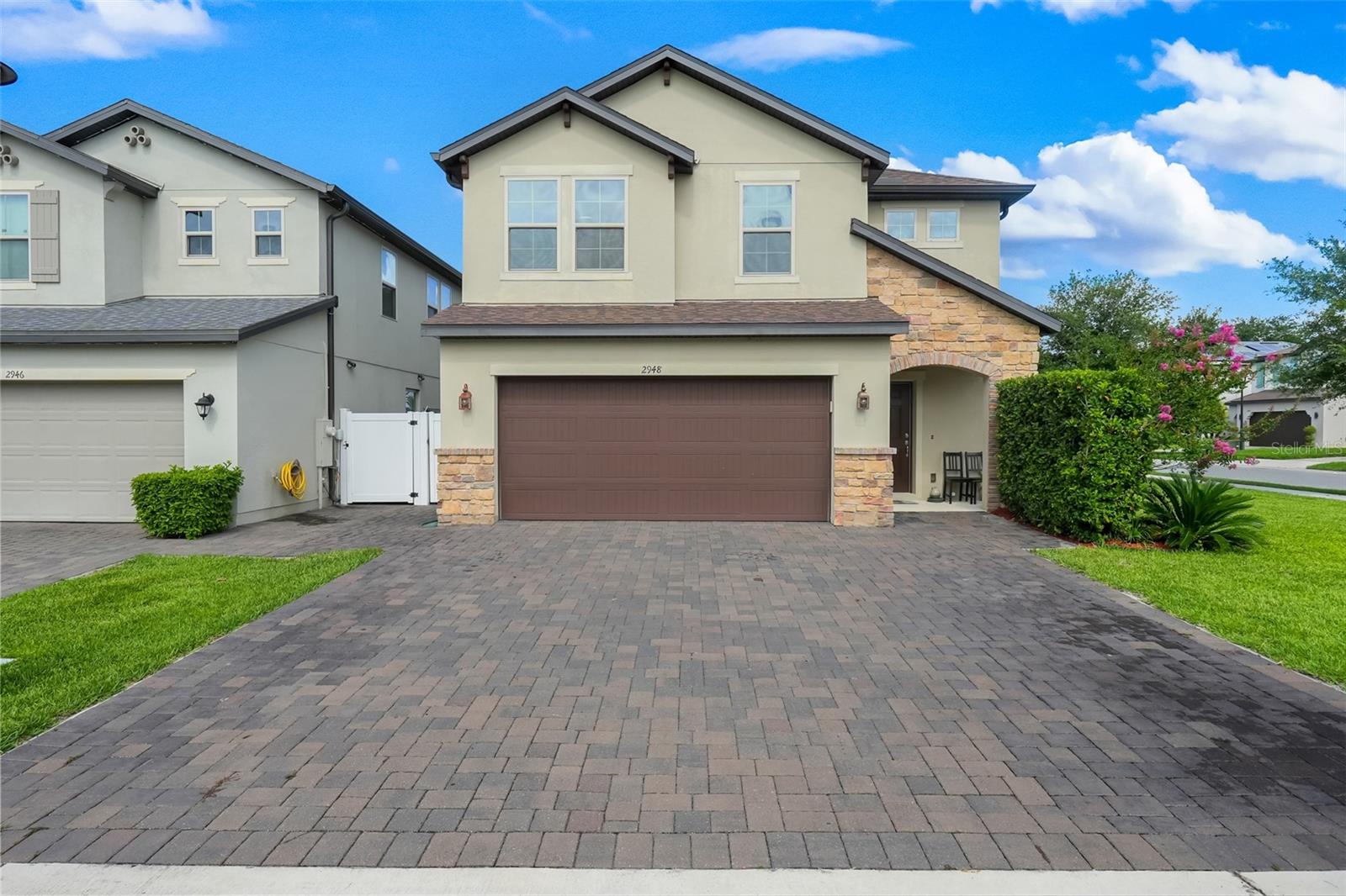Expect to be impressed by this turn-key, impeccably maintained 1,923 sq ft home designed for modern living! The bright, wide-open floor plan seamlessly connects a spacious great room to a spectacular kitchen, fully equipped with premium quartz countertops, 42-inch upper cabinets, and a massive center island perfect for entertaining. Enjoy a completely carpet-free interior featuring elegant ceramic tile throughout the first floor and durable, stylish vinyl flooring spanning the entire second level. Upstairs, convenience meets luxury with a dedicated laundry room and a private primary retreat complete with a massive walk-in closet and a spa-like walk-in shower. 
Incredible exterior upgrades include a premium paver driveway professionally extended to comfortably accommodate three vehicles. Situated in a highly desirable, well-maintained community boasting resort-style amenities including a sparkling pool, playground, and dog park and all with NO CDD fees! Strategically located just minutes from Osceola Parkway, FL-417, Lake Nona and Orlando International Airport, offering an effortless commute to theme parks, dining, and shopping. Schedule your private tour today!