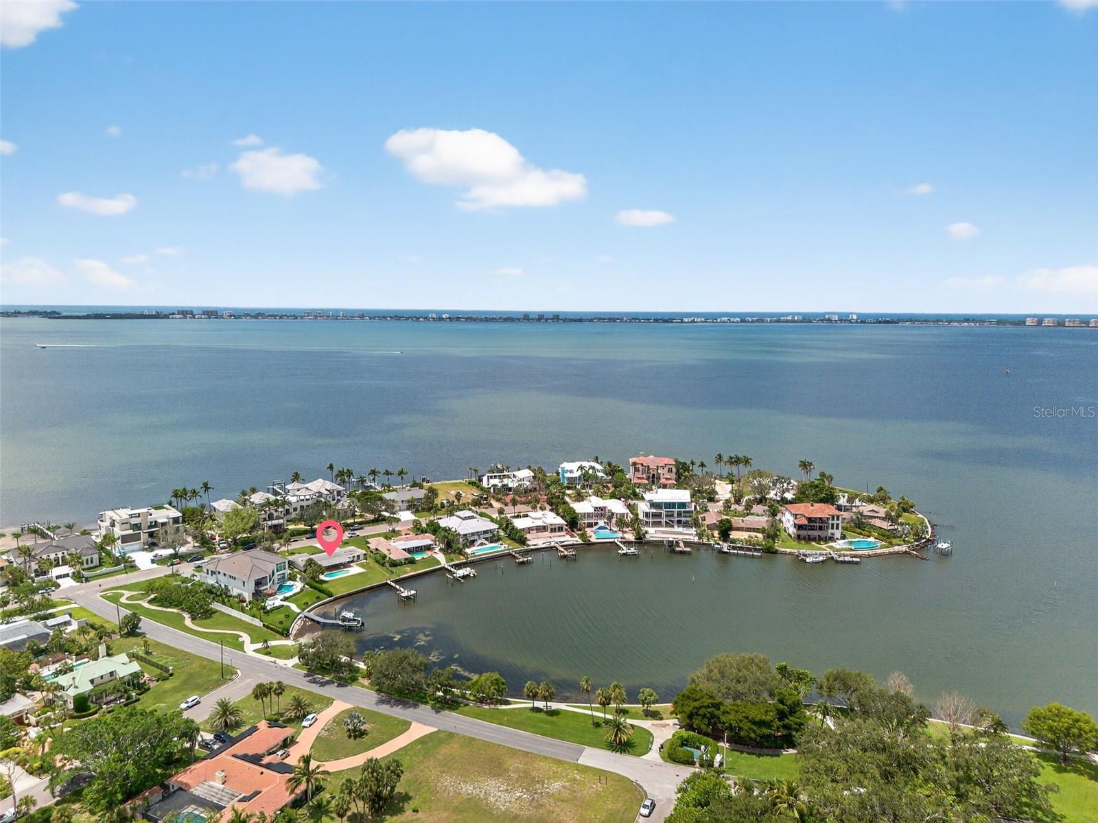 Amazing opportunity to create your waterfront estate in Sapphire Shores, where history, culture, and growth meet. This 16,378 sq. ft. lot offers 87 feet of water frontage, a private dock, and direct access to Sarasota Bay. Positioned along a quiet shoreline, it overlooks an almost 900-foot-wide deep-water basin, providing both privacy and natural beauty. Sapphire Shores combines legacy estates, striking new builds, and proximity to cultural landmarks such as The Ringling Museum and Asolo Theatre. With the North Trails ongoing transformation, including new developments, zoning updates, Ringling Colleges expansion the neighborhood is emerging as a prime location for luxury residences. Whether for a custom estate or a speculative project, this is a rare chance to secure a large waterfront property in one of Sarasota's most dynamic luxury neighborhoods.