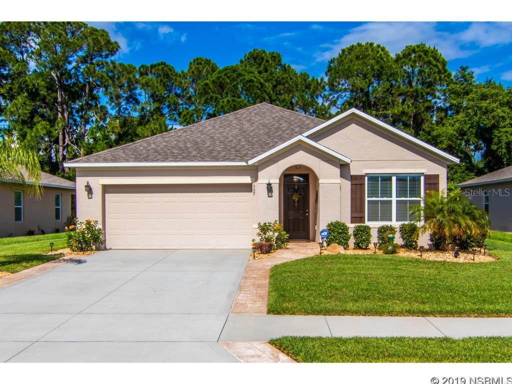 Located in Edgewater Lakes, this 3 bedroom 2 bath home is a relaxing retreat. This beautiful home has an open floor plan, high ceilings, and a gorgeous view of the wooded preserve complete with a screened in porch. The kitchen offers granite countertops, a granite backsplash, and an oversized kitchen island. The master bedroom has beautiful views of the preserve along with a walk-in closet and a master bath that offers dual vanities and a walk-in shower. Owners have included an American Whirlpool Hot Tub on the screened in porch. The home includes new interior fresh paint, new kitchen range, new dishwasher, stamped concrete along the driveway and entryway, and upgraded lighting fixtures throughout. The owner went even further to keep the home's electric cost low, by installing spray foam insulation in the rafters and an attic tent with thermal barrier. ;Water: City