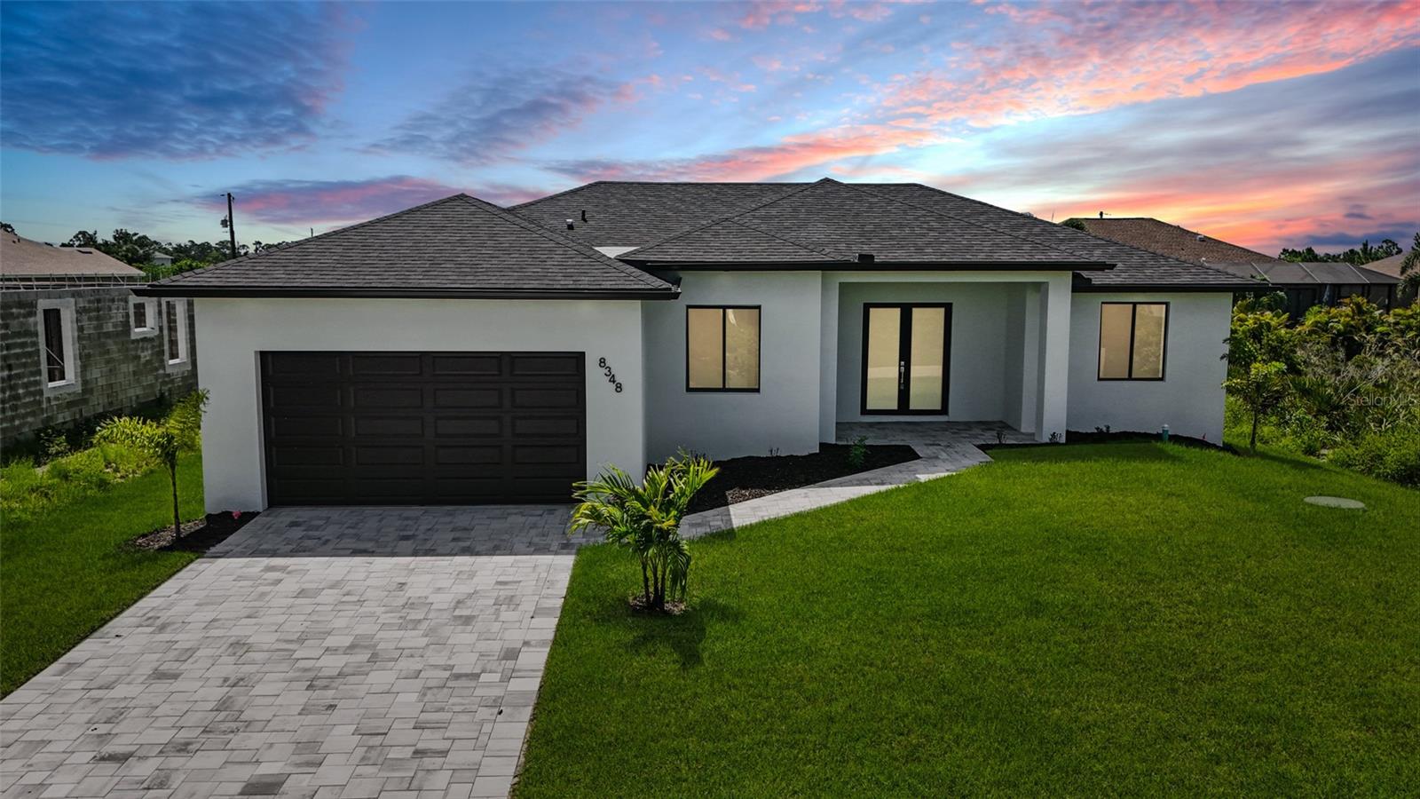 Discover modern living in this 3bedroom plus den, 2 bathroom Pool home boasting 1726 sq ft. Sleek and stylish, this home features an open concept layout, porcelain tile throughout, high ceilings and impact doors & windows. Retreat to the spacious backyard that features a covered lanai and pool perfect for large gatherings and fun. This home is located in the relaxed, waterfront community of South Gulf Cove.  NO HOA.  Seller incentives available.  Lease to own available.