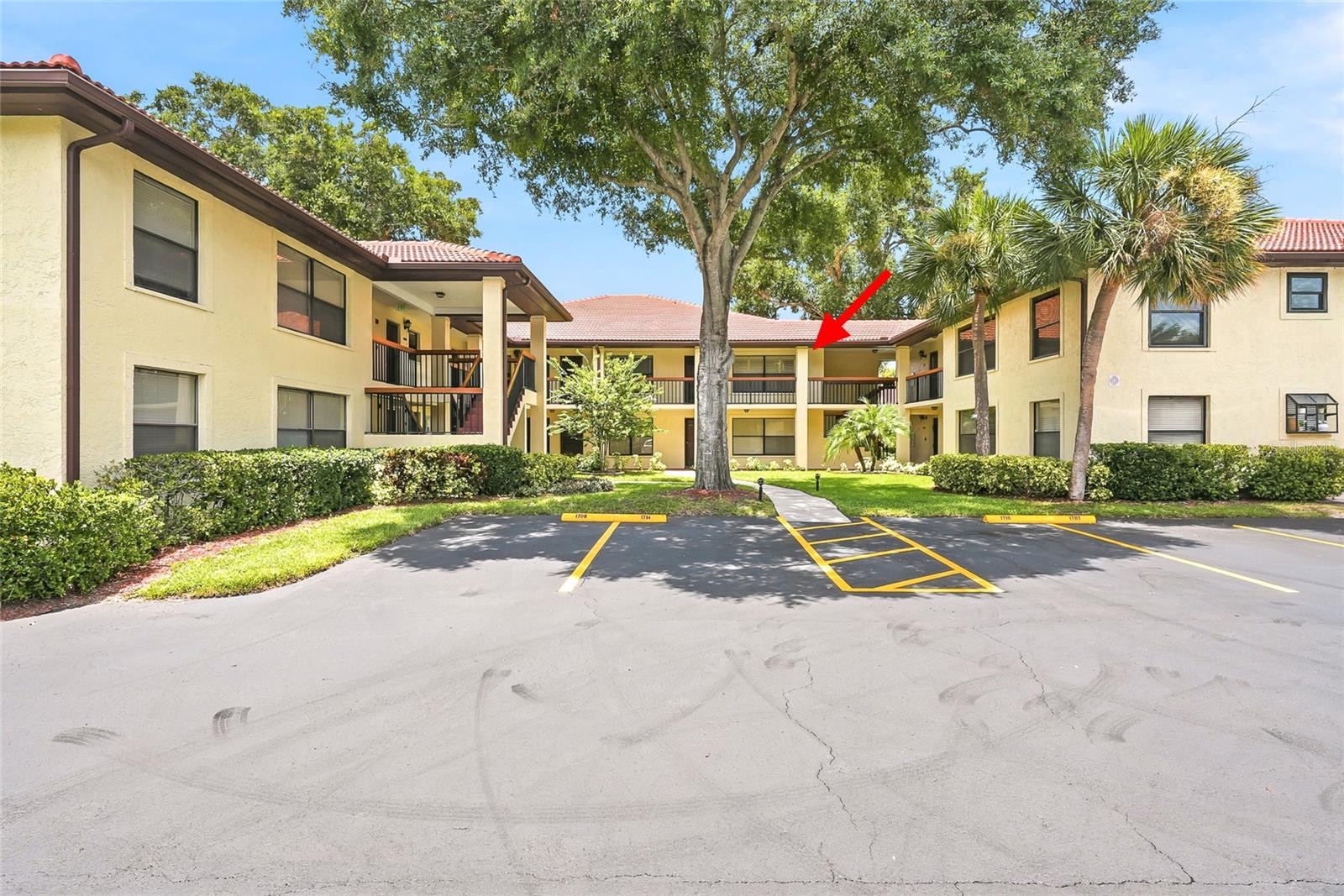 Virtually Staged. Location! Location! No flood zone, No evacuation zone. Welcome to Hammock Pine Village, a highly desirable gated community in the heart of Clearwater. This second-floor 1-bedroom, 1.5-bath condo offers a spacious and thoughtfully designed layout featuring a large primary bedroom with a walk-in closet, a private ensuite bath, and a convenient half bath for guests. Freshly painted, washer and dryer included. Enjoy Florida’s beautiful weather from your screened and tiled balcony — the perfect spot for morning coffee or evening relaxation. Assigned covered parking adds everyday convenience. Ideally located just 7 miles from Honeymoon Island State Park and 9 miles from Clearwater Beach, and only minutes to Westfield Countryside Mall for shopping, dining, and entertainment. Hammock Pine Village amenities include a sparkling community pool, tennis courts, and beautifully maintained grounds within a secure gated setting. The HOA fee provides exceptional value, covering cable, internet, water, sewer, trash, exterior maintenance, and grounds care — offering truly low-maintenance living.