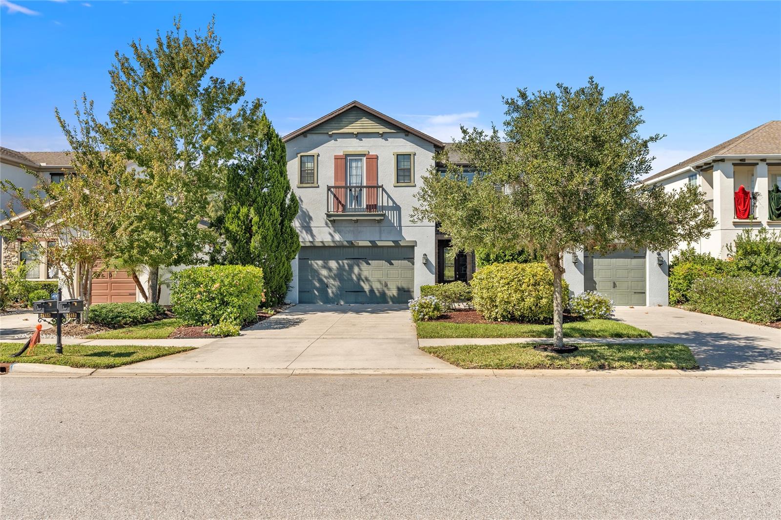 Welcome to a slice of paradise in the sought after Estancia neighborhood, where luxury living meets tranquility. This exquisite 5-bedroom, 4-bathroom home is a masterpiece of modern design, offering the perfect blend of elegance, comfort, and functionality.

As you step inside, you'll be greeted by an open-concept kitchen that is truly a chef's dream. Top-notch appliances and stunning quartz countertops adorn this culinary haven. A generously sized pantry provides ample storage space, while the breakfast bar invites casual dining. Adjacent to the kitchen, you'll find a spacious dining area bathed in natural light, perfect for hosting family gatherings and entertaining friends. For more formal occasions, the separate dining room is just around the corner.

The family/living room boasts an abundance of natural light, creating a warm and inviting atmosphere. It's the ideal place to relax and unwind, with plenty of space for quality time with loved ones.

The master suite is a sanctuary of luxury, featuring an en suite bathroom complete with a multi- jet stand-up shower and a luxurious soaking tub. His and hers quartz topped vanities add to the opulence, while a walk-in closet accessible from the master bathroom provides convenience and ample storage.
Tucked away on the other end of the home you can find the second bedroom and bathroom, perfect for guests. 

Upstairs, a loft connects to a private movie room, offering a cozy retreat for cinematic experiences. The remaining bedrooms and bathrooms are also located upstairs, with two of the bedrooms sharing a bathroom while bedroom 5 has an en-suite bathroom. All bedrooms come with spacious closets, ensuring everyone has plenty of storage space.

Laundry day becomes a breeze in the separate, generously sized laundry room, equipped with everything you need to make chores effortless.

Step outside to discover your own personal oasis. A covered lanai beckons you to relax in the shade, while the large backyard boasts mature trees and lush greenery, overlooking some of the best conservation Wesley Chapel has to offer. This creates a serene backdrop for outdoor activities and the potential for your dream pool. The vinyl fence to the right ensures privacy and security, while the front of the home faces a nature lovers lake, full with fish, wildlife and provides serene walking opportunities. 

This luxurious home is part of the exclusive Estancia neighborhood, where residents enjoy an array of amenities. Take a dip in the huge community pool with its exhilarating water slide or swim laps for exercise. Play a match on one of the multiple tennis or basketball courts, let your little ones enjoy the playground, or explore the walking trails that wind through the neighborhood. The clubhouse with a fitness center completes the package, offering everything you need for an active and vibrant lifestyle.

Don't miss the opportunity to make this remarkable luxury home your own. It's a place where elegance, comfort, and community come together in perfect harmony. Schedule a viewing today and experience the epitome of upscale living in Estancia.