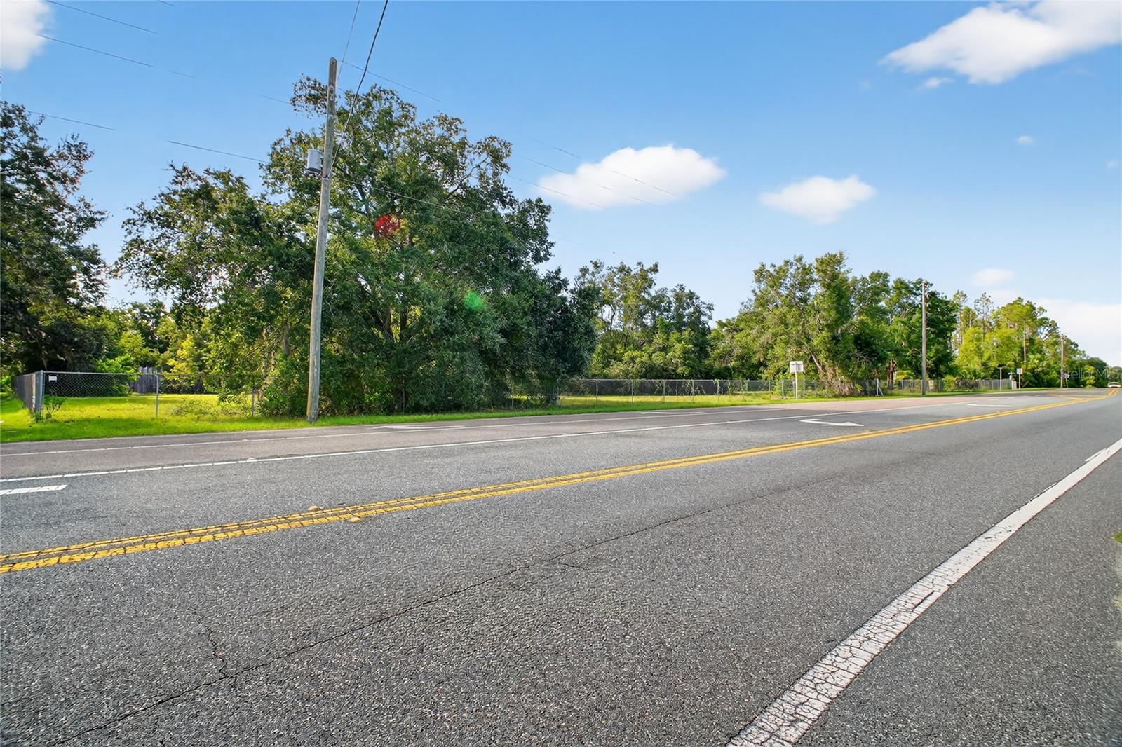 Offered is a Commercial (C2) corner on HWY 19 in Altoona.   Just next to the Altoona Post Office, this C2 piece is Highly Visible at the corner of Clark Rd and is fully fenced with 405' of Frontage on 19 and 275' of Frontage on Clark Rd.   The Future Land Use (FLU) is rural transition with Lake County and the City of Umatilla would be willing to Annex.   There is a 12' water main across HWY 19.  Approximately 18,000 cars a day per a recent DOT study just South of this property.   HWY 42 is only a block North.   This is a great location with many potential uses; Professional offices, RV-Boat-Self Storage, assisted or independent living, Restaurant, medical - veterinary, etc.  Land is virtually ready to build and a nice grade level.   Come take a look today.