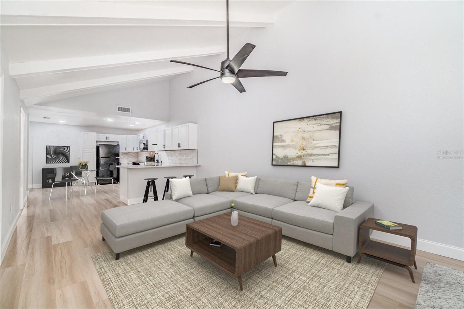 This meticulously renovated home in the heart of Fort Myers offers a captivating blend of contemporary design and Florida charm. Now featuring a significant price reduction, this property presents a unique opportunity for both homeowners and investors as it comes with a tenant in place, providing immediate rental income. The interior boasts an expansive, bright, and open floor plan adorned with luxurious vinyl flooring that flows seamlessly throughout. A beautiful fireplace adds a touch of character and warmth to the living space, creating an inviting atmosphere for relaxation or entertaining. The great chef's kitchen serves as a true highlight of the home, featuring ample counter space and stylish shaker-style cabinets designed for culinary enthusiasts and everyday ease. Modern conveniences include a newer AC unit, a tankless water heater for endless hot water on demand, and a large screened-in lanai that offers a private oasis for enjoying the Southwest Florida weather. As a resident of Royal Woods, you will have access to fantastic community amenities, including a clubhouse, swimming pool, tennis courts, and shuffleboard courts. The community is also pet-friendly. Centrally located in Fort Myers just off US-41 and near I-75, this home is a short drive from pristine beaches, diverse shopping, exquisite dining, and the Southwest Florida International Airport (RSW). Whether you are looking for a primary residence or an investment with a tenant already secured, this meticulously renovated gem delivers a premier Florida lifestyle. Schedule your private showing today.