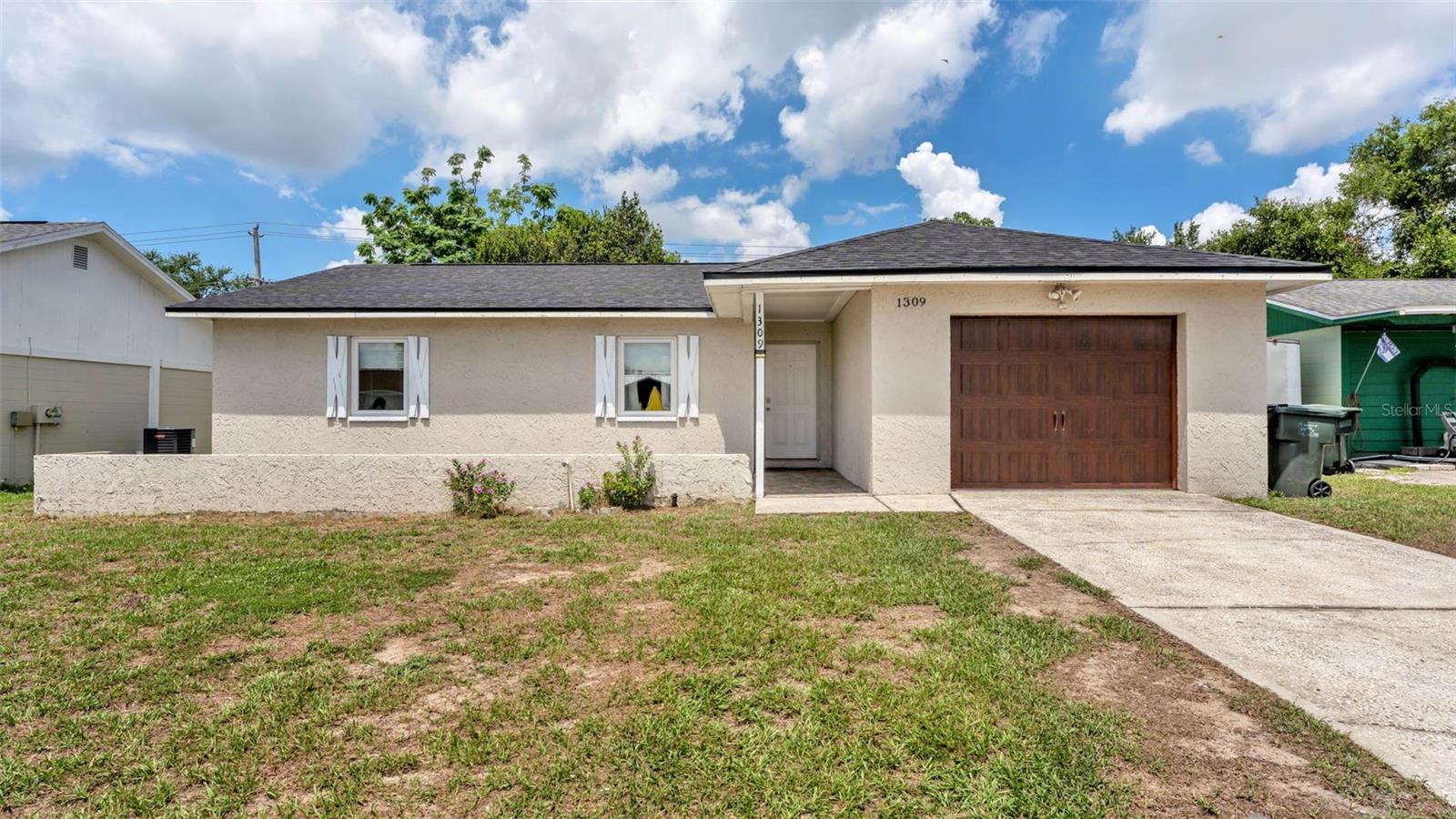 Welcome home to this well-maintained and charming 3-bedroom, 2-bathroom residence with a BRAND NEW ROOF installed June 2026, ideally located in Lakeland, just minutes from Southeastern University, Grove Park Publix, shopping, dining, and everyday conveniences. Offering a functional and inviting layout, this move-in ready home features spacious living areas, luxury vinyl flooring throughout all of the home, a cozy fireplace, and an updated kitchen with a pantry, stainless steel appliances, and plenty of cabinet and counter space. Two additional bedrooms provide room for family, guests, a home office, or hobbies. Step outside the sliding glass doors from the living room to the lanai and enjoy your own backyard retreat. The screened lanai features a relaxing spa that stays with the home, creating the perfect place to unwind after a long day. The fully fenced backyard offers plenty of space for entertaining, pets, gardening, or outdoor activities, and even includes an above-ground pool for enjoying Florida's sunshine. Additional highlights include a one-car garage, updated finishes, and a convenient location near Southeastern University, Grove Park Publix, downtown Lakeland, medical facilities, and major commuter routes. Whether you're looking for your first home, a primary residence, or an investment opportunity in a growing area of Lakeland, this property is one you won't want to miss. Schedule your private showing today and discover everything 1309 Cinnamon Way W has to offer, including the spa that stays!