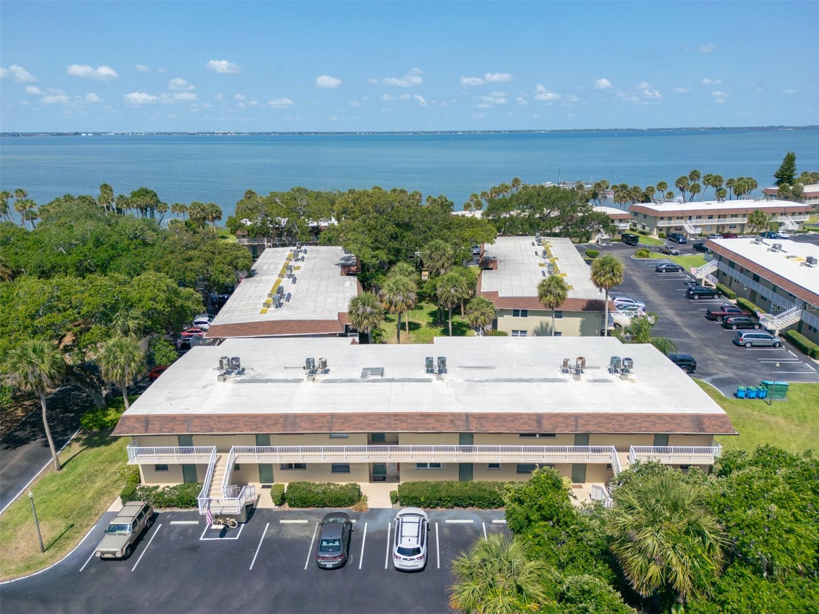 Ground-floor 1 bed, 1.5 bath condo in the Cape Shores community, minutes from the ocean and nestled on the Banana River! This light-filled furnished unit features an open floor plan with tile flooring throughout. The kitchen features ample cabinet storage, shelving and counter space, with bright appliances and a lighted vaulted ceiling. The primary features a generous walk-in closet, sliders to a private screened patio, and spacious en suite bath. Both bathrooms have been thoughtfully updated with modern fixtures. Residents enjoy boating, fishing and kayaking with direct river access from the community dock. A fitness center, sauna, pool, shuffleboard, putting green, car wash, laundry, and grill area complete the package--all in a pet-friendly community! With a 3-month rental minimum, this home is a great investment, vacation escape or perfect for year-round living. Blocks from the sand and minutes from shops, dining, and attractions, this condo delivers the best of coastal living. Schedule your showing today!
