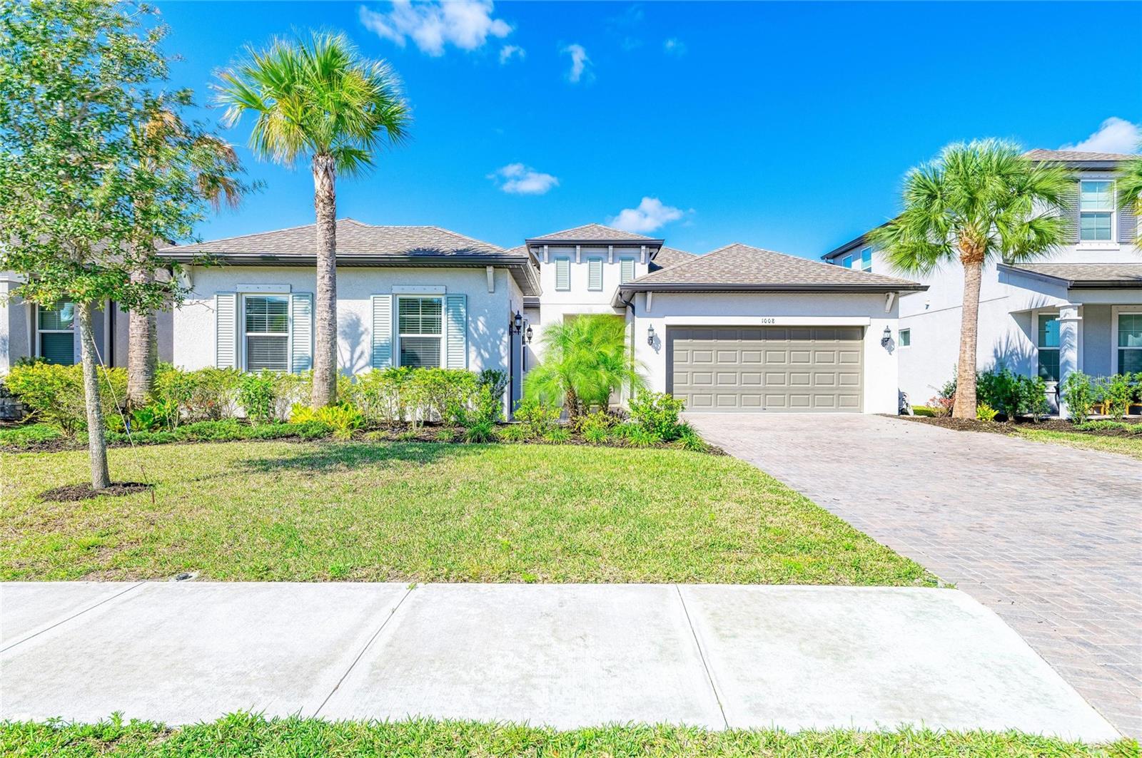 Welcome to the gated community of Riverside Preserve!  This beautifully appointed 4 bedroom/ 4 bath home offers the peace of mind of newer construction,  an amazing layout, and a highly sought after mother-in-law suite with separate entrance!  Ceramic tile flooring throughout main living areas, high ceilings, and beautiful natural light add allure to this stunning home.  The kitchen is designed to please the chef of the house  with tons of cabinet space, a pantry, quartz countertops and stainless steel appliances and is perfect for entertaining with large island with seating area and an open floor plan.  The large primary suite is a continuation of excellent design touches with a spacious walk-in closet and his/hers sinks and a gorgeous walk-in shower with seating.  2 additional bedrooms and baths are perfect for family and or guests.  The In law suite has a private entrance with its own living room, 1 car garage,  a small kitchenette and separate bath.  Another well thought of addition to this home is the large screened lanai featuring an outdoor kitchen/grilling area!  This beautiful tight-knit community has only just over 100 homes and has an attached 16 acre preserve with direct  access to the Manatee River for kayaks and stand up paddle boards and a picnic/grilling area.  This home truly has all the Florida lifestyle has to offer!  NO CDD FEES!  LOW HOA FEES! NOT A FLOOD ZONE!  Drive to the world famous beaches of Florida's Gulf Coast!  Don't miss out on this one!