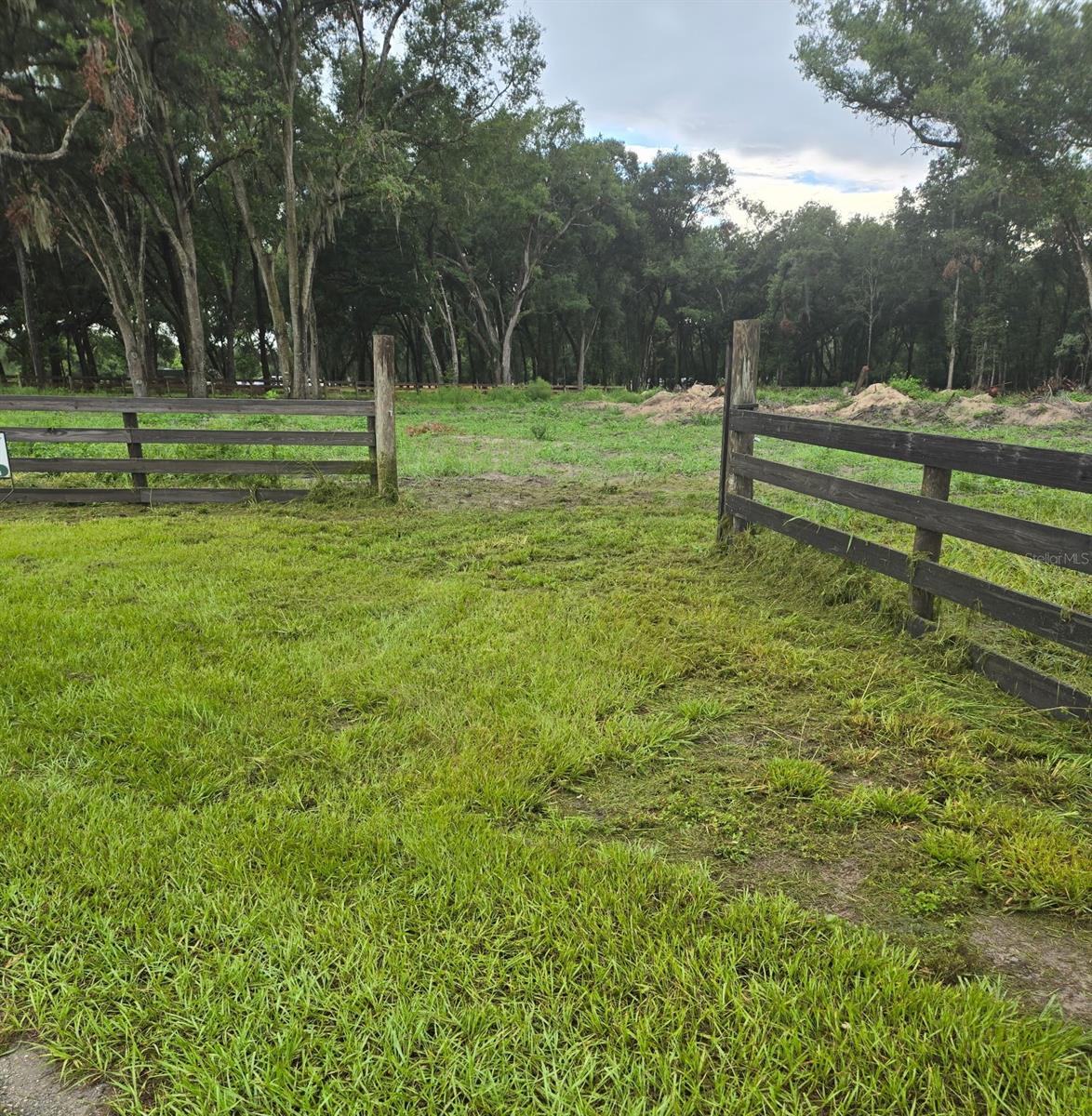 Rare 6.53-acre fully fenced property featuring quality 4-board fencing, majestic mature draping oak trees, and a partially cleared landscape ready for your dream home or mini farm. Zoned for animals, this beautiful property offers the perfect combination of privacy, open space, and natural Florida beauty. Enjoy peaceful views of Lake Stella and the convenience of being just minutes from Crescent Lake and nearby public boat launches for world-class fishing and boating. Plenty of room for horses, livestock, barns, workshops, RVs, gardens, and more. Whether you're looking to build a private country estate, equestrian property, or weekend retreat, this versatile acreage offers endless possibilities. A rare opportunity to own a stunning piece of Old Florida with easy access to recreation while enjoying the peace and quiet of country living.