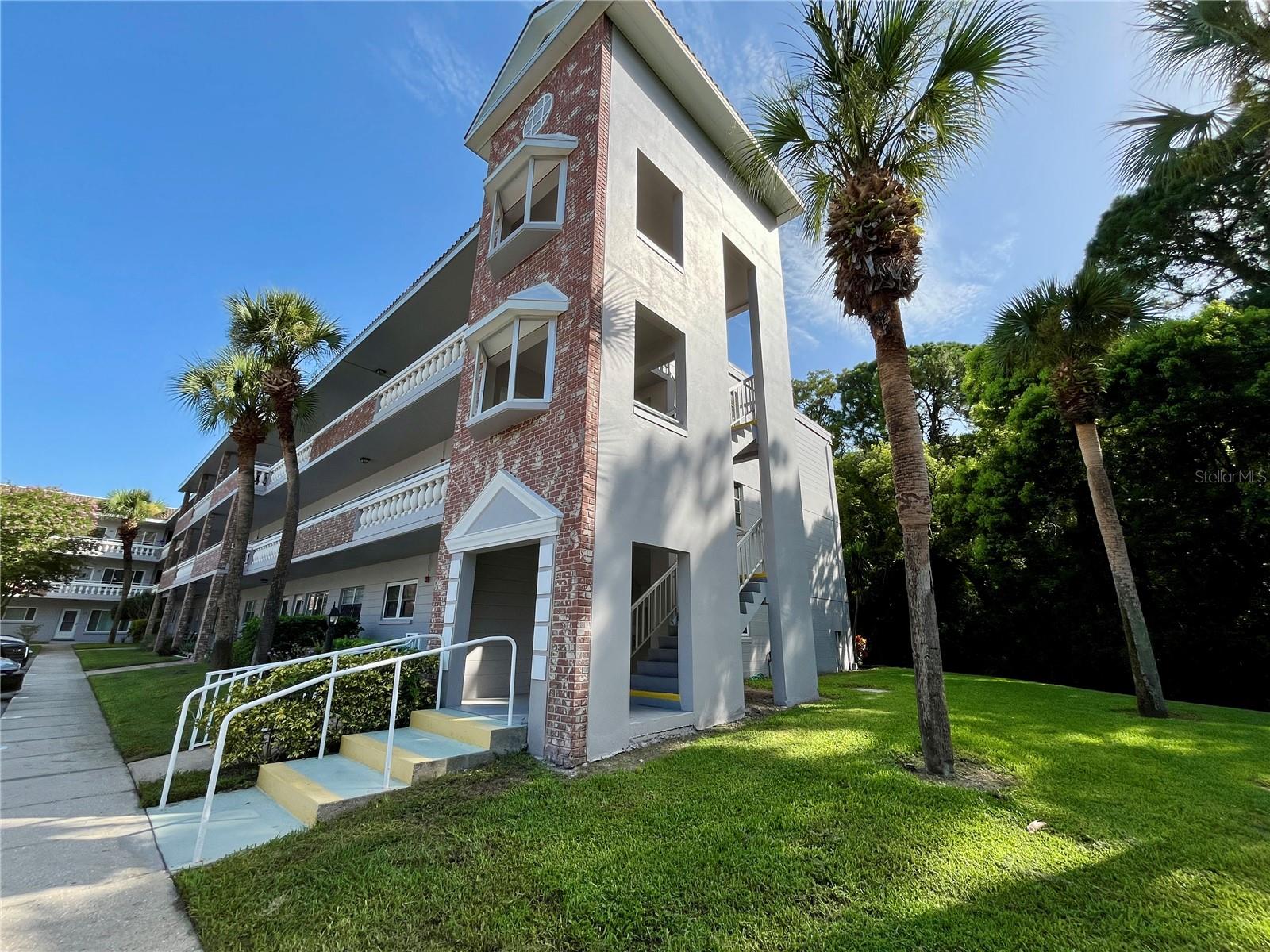 1st floor End Unit! This furnished updated condo has everything you need. Enjoy updated hurricane impact windows overlooking the preserve and window shades and knock down ceilings. Featuring updated flooring and fresh paint throughout. The extra windows make a huge difference. The kitchen features updated cabinets and reverse osmosis filtered water. Washer and dryer in unit. A/C was replaced in 2022. The windows feature stainless steel windowsills. The primary bedroom features an adjustable bed for your comfort and a ensuite bathroom. This property is a gem. Make your showing today! Assigned parking. The 55+ community has two activity centers, and two private golf courses with 9 and 18 holes, free exclusively for residents. There are two heated swimming pools. The remodeled Cardio Gym has the latest exercise equipment. A very pet-friendly community, there is a fenced dog park with covered seating. There are hobby studios, and a wood shop for the exclusive use of the residents. Activities include fitness classes, dancing, clubs, cards, billiards, entertainment, classes, and much more. The on-site Good Karma Café has take & bake meals and snacks. Close to beaches, transportation, shopping, entertainment, and fine dining. All room sizes, floor plans and square footage are approximate. This property is being transferred by a leasehold estate deed. . Association approval is required. If financing, a 35% down payment is required. All washer, dryer and hook ups must be approved by the association.