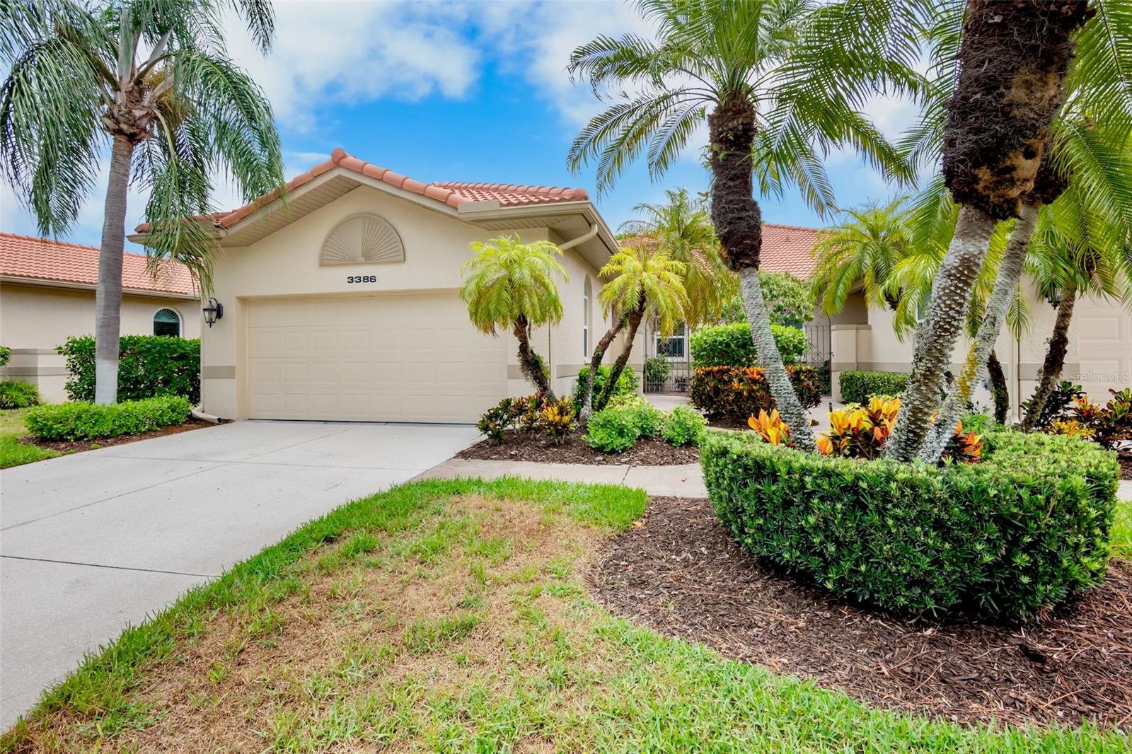 BEST VALUE in The Meadows for a 2/2/2 villa! This wonderfully situated villa with a fabulous golf course and water view is your chance to apply your decorating ideas to create a truly stand-out property. Enter your private courtyard through the iron gate and step into your villa through the 6ft wide hallway.  The 10 foot ceilings are capped with classic crown molding and picture molding. Enjoy the view and fresh air with your morning coffee or favorite refreshment on the lanai. Storm protection is provided by the electrically operated shutters and steel-reinforced garage door. Chelmsford Close is one of the most recently constructed communities in The Meadows- you’ll find no popcorn ceilings, or cast iron plumbing, and the property is outside of the flood zones. The villa is of solid block construction capped with barrel tile roofs and the very reasonable condo fees cover ALL exterior maintenance, and even include high speed Fiber-Optic internet service. Thge Meadows offers numerous recreational activities, including 16 miles of walking/biking trails, 3 Golf courses, tennis and pickleball courts, a fitness center and even a dog park. Some of the country's most beautiful beaches are nearby, as well as world-class arts and culture, restaurants, entertainment and shopping- you’re literally a 5 minute walk to Benderson Park and just 2 miles from the mall at University Town Center. THIS is the Sarasota lifestyle!