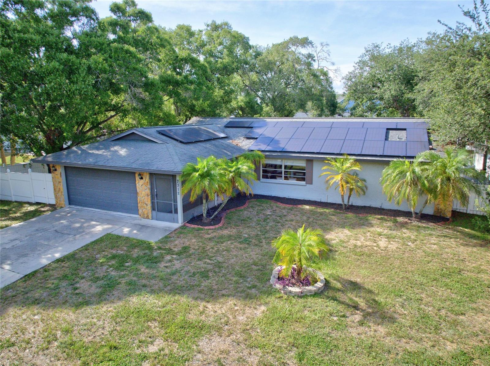 Coming Soon! Welcome to this beautifully renovated South Tampa pool home, perfectly situated on a rare oversized triple lot in the heart of Port Tampa. Offering the ideal combination of modern updates, outdoor living, energy efficiency, and exceptional flexibility, this move-in-ready residence presents a unique opportunity for homeowners, multi-generational living, or those seeking room to expand. The expansive triple lot offers the rare opportunity to create a private family compound, add a detached guest house or accessory dwelling unit (ADU) for extended family or guests (subject to local zoning and permitting), or simply enjoy the privacy and space that's becoming increasingly difficult to find in South Tampa. With approximately 15,000 square feet across three lots, this exceptional property also offers outstanding long-term flexibility and investment potential.

From the moment you step inside, you'll appreciate the bright, open floor plan enhanced by luxury vinyl plank flooring throughout, abundant natural light, and tasteful modern finishes. At the center of the home is the stunning chef-inspired kitchen, thoughtfully renovated with granite countertops, custom all-wood cabinetry, a sleek electric cooktop with decorative vent hood, convenient pot filler, stainless steel appliances, generous island seating, and an open design that flows effortlessly into the main living and dining areas—perfect for everyday living and entertaining.

The spacious primary suite provides a relaxing retreat and features a beautifully remodeled en-suite bath with contemporary finishes, while the additional bedrooms offer flexibility for family, guests, or a home office.

Step outside to your own private Florida oasis featuring a screened-in pool, covered lanai, and an expansive backyard with room to entertain, garden, play, or simply unwind.

The home also features a leased solar panel system that has consistently produced more electricity than the home has consumed during the current owner's ownership, resulting in substantial energy savings and annual net-metering credits. The assumable solar lease provides the next owner the opportunity to enjoy the same energy-efficient benefits and the potential for more consistent, predictable monthly energy costs, with actual savings dependent on individual energy usage.

Located just minutes from MacDill Air Force Base, Gandy Boulevard, Downtown Tampa, Tampa International Airport, waterfront parks, shopping, dining, and everything South Tampa has to offer, this home delivers an exceptional combination of location, lifestyle, flexibility, and future value.

Whether you're searching for a beautifully updated pool home to enjoy for years to come, an oversized homesite with exceptional expansion potential, or a rare South Tampa investment opportunity, this exceptional property truly offers the best of all worlds.