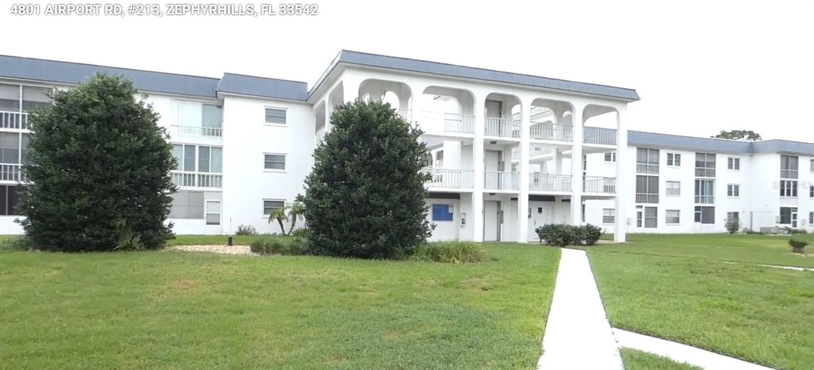 This Block Condominium is located in the 55+ community of Zephyr Estates East in Zephyrhills, Florida, and is situated in a non-flood zone according to county records. Built in 1975, it features 2 bedrooms, 2 bathrooms, concrete block construction, central heating and air conditioning, and includes a covered carport for parking. The building also has an elevator, making everyday living much easier by providing convenient access to the unit. The community is conveniently located directly across the street from the Zephyrhills Municipal Golf Course, making it an excellent location for golf enthusiasts or anyone who enjoys beautiful green views. One of the most outstanding features of this unit is its exceptional view of the community pool—one of the best in the complex—providing a relaxing and picturesque setting that few units can match. Another unique feature of this community is the large Hobby Shop located near the pool. Homeowners have 24-hour access, 365 days a year, giving them the opportunity to enjoy woodworking, crafts, repairs, and other hobbies whenever inspiration strikes. It's a rare amenity that creates a welcoming place to build, create, and socialize with neighbors while enjoying your favorite pastime.
Less than 60 miles to St. Pete Beach, named the #1 Beach in America and the 5th Best Beach in the World. Please view both videos: Tour 1 and Tour 2.