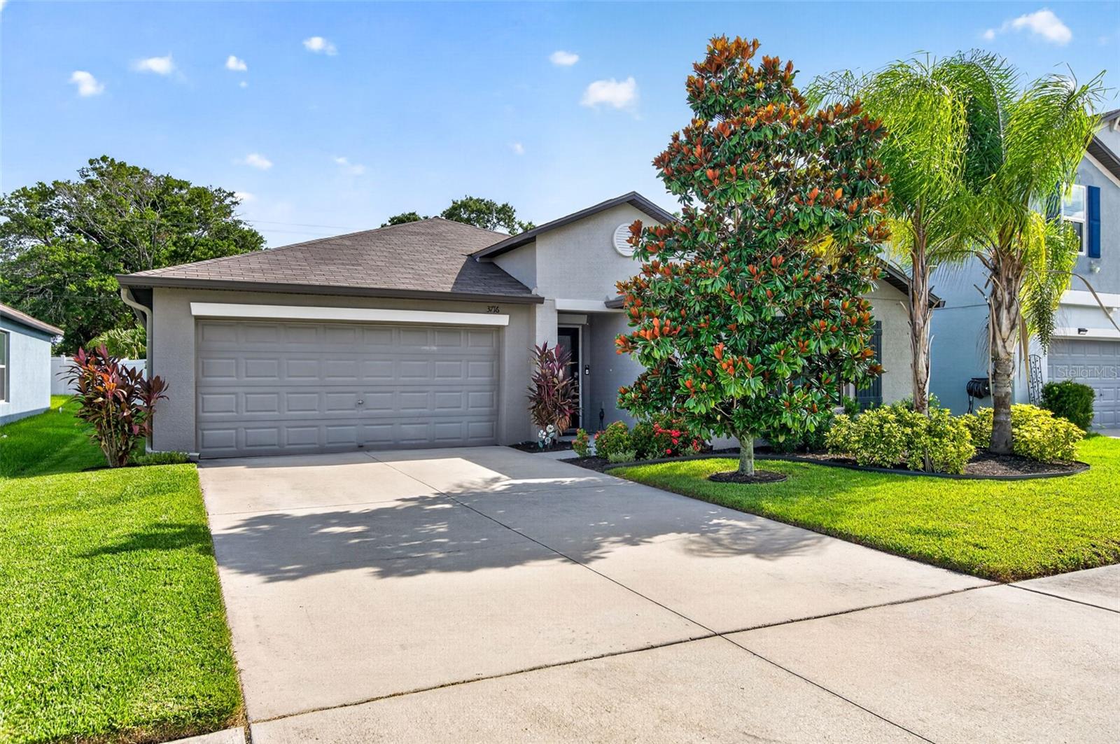 Welcome to this beautifully upgraded 4-bedroom, 2-bathroom home offering 1,935 square feet, a sought-after split-bedroom floor plan and an open-concept layout. This home is filled with natural light and provides the perfect balance of comfort, style, and functionality. The spacious kitchen is both elegant and practical, showcasing quartz countertops, a stunning marble backsplash, an undermount sink, upgraded faucet, ample cabinetry and countertop space for cooking and entertaining. Ceramic tile flooring flows throughout the main living areas, one bedroom has durable luxury vinyl flooring and the others feature plush carpeting. Step outside to your own private backyard retreat. The fully fenced yard is enhanced by beautiful landscaping and a pavered screened lanai that is partially covered for shade, creating the perfect setting for year-round outdoor living. Relax and unwind in the hot tub while enjoying the privacy of your backyard oasis. Additional upgrades include a water softener, gutters, an upgraded hurricane-rated front door with a decorative glass insert, a newer water heater, and convenient attic improvements including an access ladder, lighting, and a lift system for easy storage. Residents of Touchstone enjoy access to fantastic community amenities including a resort-style pool, fitness center, and playground. Conveniently located just minutes from the Crosstown Expressway, this home offers an easy commute to Downtown Tampa and MacDill Air Force Base. Brandon and Tampa's abundant shopping, dining, entertainment, and recreational opportunities are all nearby, making this an ideal location for enjoying everything the Tampa Bay area has to offer. With its extensive upgrades, inviting indoor-outdoor living spaces, and prime location, this move-in-ready home offers the best of Florida living. Book your showing before this gem is gone!