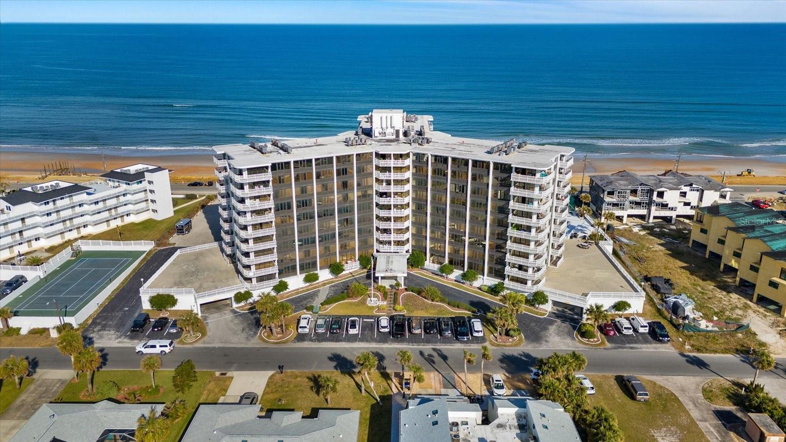 Experience the relaxed coastal lifestyle in this well-maintained condominium unit located on the first floor.  This west-facing residence is filled with natural light and showcases peaceful views of spectacular Florida sunsets. The thoughtfully designed floor plan features an inviting living and dining area, two spacious bedrooms and two bathrooms, creating the perfect space for full-time living or a beachside retreat.  Residents enjoy an impressive selection of resort-style amenities, including beach access just steps away, an oceanfront swimming pool, fitness center, tennis court, elevators, secure under-building parking, and beautifully maintained grounds. Ideally situated along scenic A1A, you'll be just minutes from the restaurants, shops, entertainment, and fishing pier in charming downtown Flagler Beach, while remaining conveniently located between St. Augustine and Daytona Beach. Don't miss this opportunity to enjoy carefree coastal living in one of Flagler Beach's premier oceanfront communities.