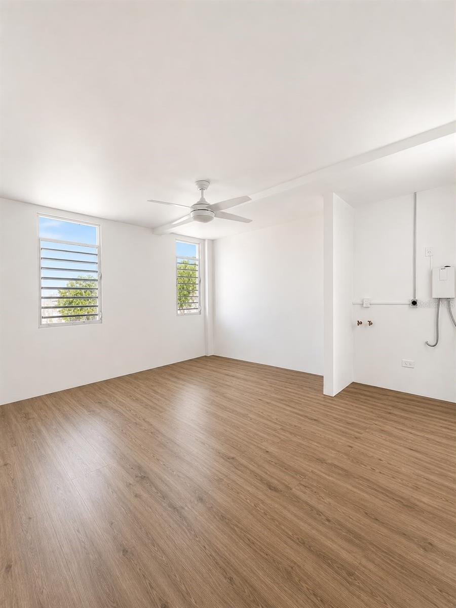 A beautifully remodeled one-bedroom apartment is available for rent on the third floor of Blasini Residences, conveniently located in one of the most central areas of Ponce, Puerto Rico. Its prime location provides easy access to universities, hospitals, shopping centers, and the city's main highways, making it an excellent choice.

The apartment features one bedroom, air conditioning in the bedroom, a refrigerator, cooktop, washer, dryer, and water heater. The building also offers security cameras for added peace of mind.

Located just seven minutes from Ponce Health Sciences University (PHSU), this apartment will be available for occupancy in August.

**Note:** The kitchen is currently being installed. The images shown are for illustrative purposes only and represent a similar design to the completed kitchen.