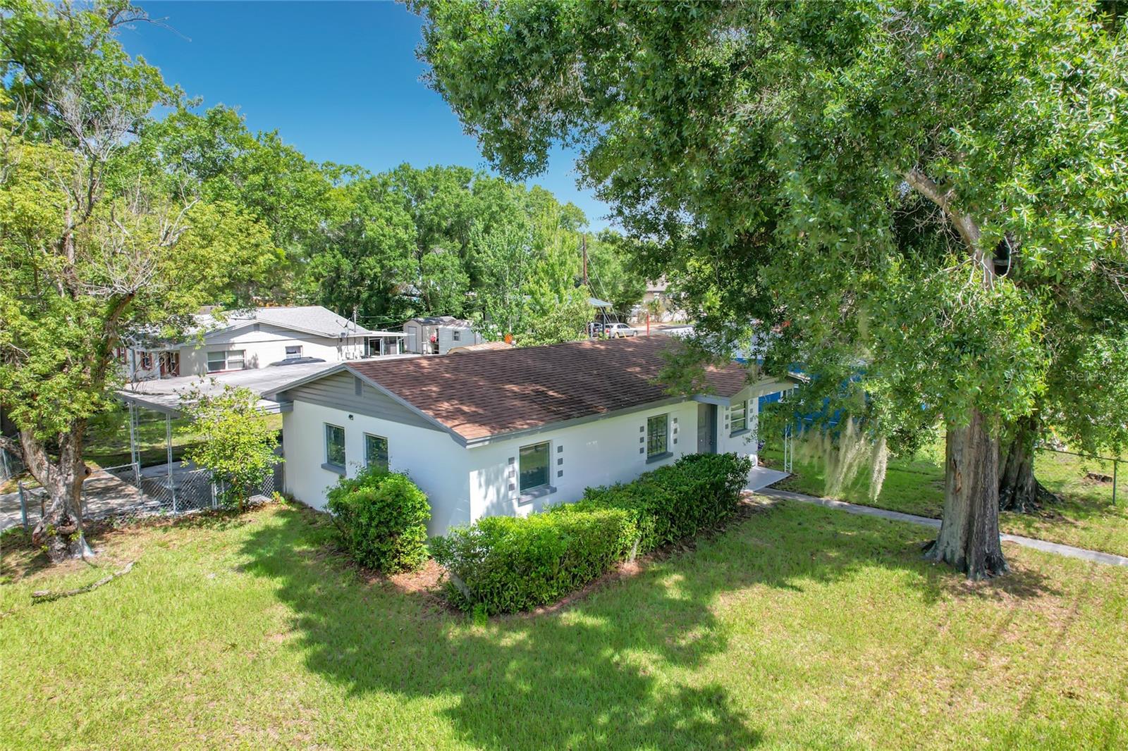 Great starter home FRESHLY PAINTED INSIDE AND OUTSIDE! No CDD or HOA. Unique, cozy, and cute 3 bedroom 1 bath BLOCK home on the quiet street. Corner Lot, Mature trees, chain link fenced around the house. Home has 8 x10 all very unique block/concrete storm shelter/storage/play room. Roof, AC, Hot Water Heater, and Driveway were replaced in 2019 and Tile Flooring in 2020. Stainless steel appliances. Conveniently located near downtown, highways, schools, shopping centers, and gas stations. Close to the Lakeside Village Outdoor Shopping Mall.