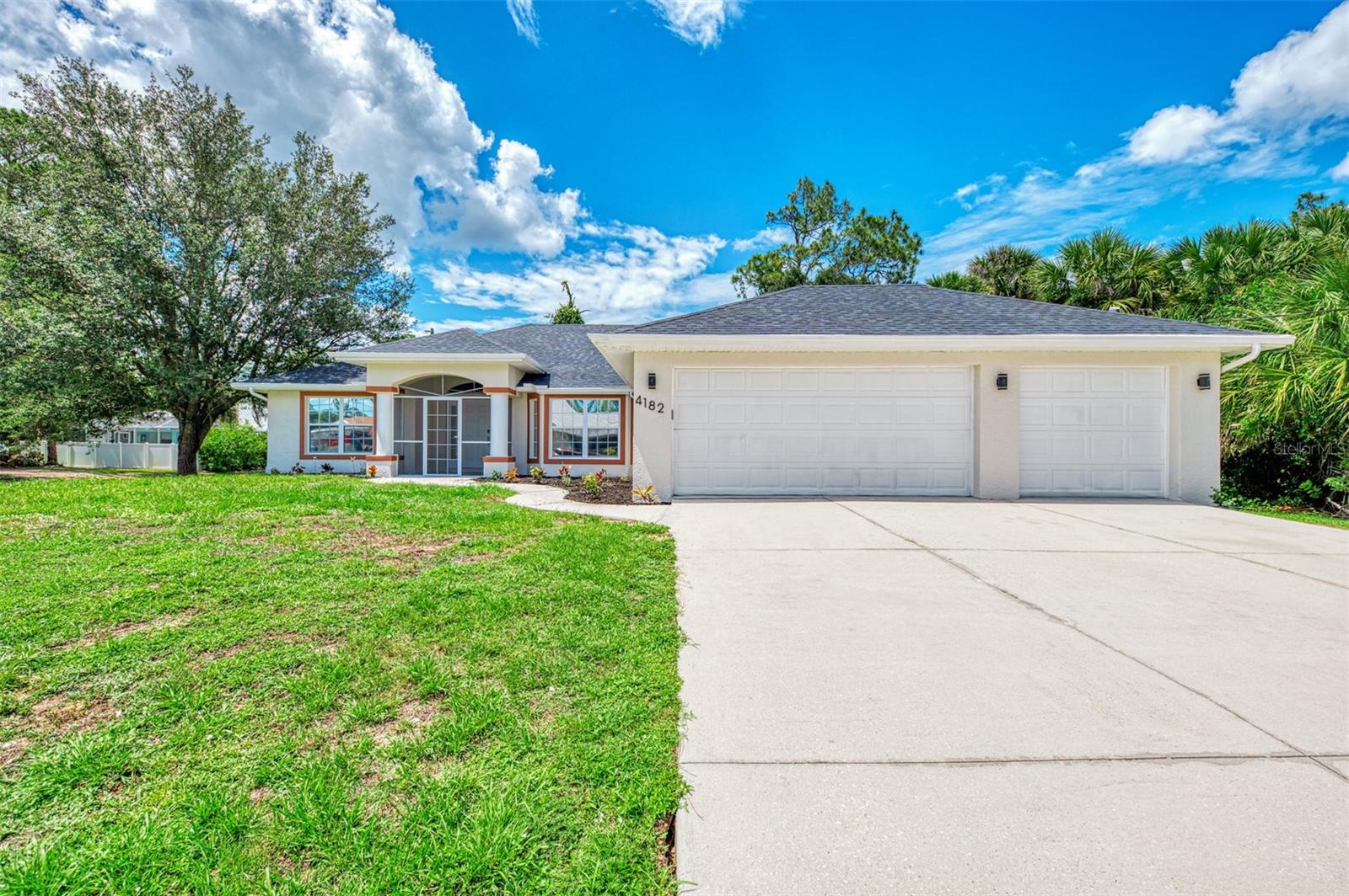 “Welcome to 4182 Magenta Avenue, a stunning, fully renovated 5-bedroom, 2-bath home in North Port’s sought-after community. Situated on an oversized corner lot, this residence boasts a spacious 3-car garage and exquisite finishes throughout. Step inside to discover a gourmet kitchen with soft-closing wood cabinets, quartz countertops, a modern tile backsplash, ambient LED lighting, and luxury vinyl plank floors. The entire home features all new lighting fixtures, including recessed lighting, and fresh paint both inside and out. Both bathrooms are completely updated with a freestanding tub, fully tiled frameless glass showers, shower niches, lighted LED mirrors, and new plumbing fixtures. Plus, enjoy peace of mind with a brand-new roof, a water filtration system, and a beautifully refreshed interior and exterior. Don’t miss this exceptional opportunity—schedule your private tour today!”