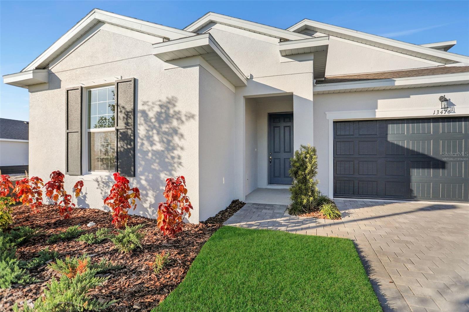 Virtually Staged. Under Construction. Spacious 4-bedroom, 3.5-Bath home located in Punta Gorda’s newest resort-style, low-maintenance community, Turnleaf. This open-concept two-story home features a modern kitchen with wood-look shaker-style cabinetry and white quartz countertops. Oversized ceramic tile flooring throughout the entry, Kitchen, dining and great room. Oversized sliding glass door leads to your covered lanai and backyard oasis. This home provides an additional living space upstairs in your bonus room. This large space includes a full-size bathroom and a walk-in closet which provides endless possibilities with how to utilize this added space. Conveniently located minutes from historic downtown Punta Gorda, the area’s finest marinas, the area’s top golf courses, Punta Gorda Airport, Peace River Botanical Gardens,