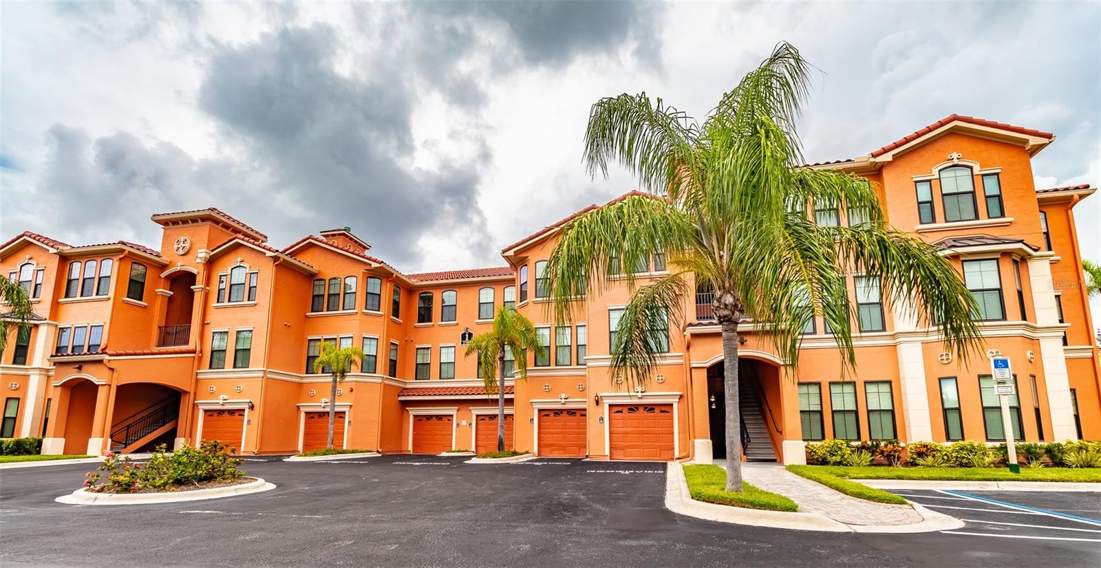 Is it your dream to live on a waterfront property that feels like you are on vacation every single day that you wake up? Look no further! The Grand Venezia is a luxury waterfront, gated community, located on the gorgeous Tampa Bay. This 2nd floor home is a spacious 2 bedroom/2 bath condo that is just waiting you to make it your own paradise. Once you enter this beautiful home, you will immediately notice the neutral tile throughout the open dining, kitchen, and extended living room & carpeted bedrooms.  The open kitchen features pristine granite countertops throughout including a breakfast bar/ entertainment bar, which opens up to the dining room. If you like entertaining, this open floor plan is a dream come true. Additional features include 9' ceilings coupled with crown molding in the living, dining, kitchen, and master bedroom. This home also features a full size washer/ dryer in the enormous laundry room. How about amenities? There is so much to do on the property! The Grand Venezia has resort style amenities which include geo thermal heated pool/spa, sauna, lighted pickle ball and tennis courts, playground & free car wash area. The updated fitness center is open 24/7 featuring cardio and strength training equipment. Enjoy walking or jogging on the 1.5 mile lighted water front promenade. The guard pavilion is attended 24 hours a day for the property.