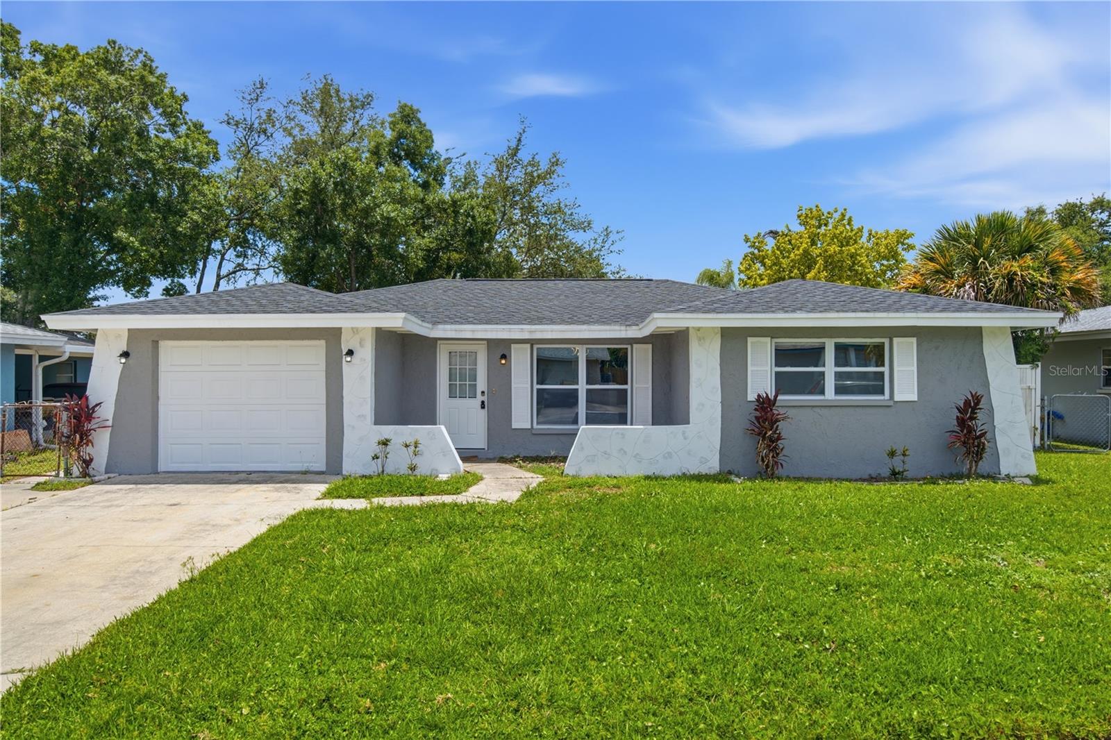 Nestled in the heart of Oldsmar, this location offers the perfect blend of small-town charm, outdoor recreation, and everyday convenience that makes living in Harbor Palms so desirable. Situated HIGH AND DRY with NO history of flooding, residents enjoy being just minutes from the waterfront parks and trails along Tampa Bay, including R.E. Olds Park, Veterans Memorial Park, and the scenic Upper Tampa Bay Trail. Whether you're spending the day kayaking, biking, fishing, or enjoying one of the area's many community events, Oldsmar embraces an active Florida lifestyle while maintaining a welcoming neighborhood feel.

This beautifully renovated 3-bedroom, 2-bathroom POOL home offers over 2,100 square feet of thoughtfully designed living space. From the moment you arrive, the inviting curb appeal sets the stage for the upgrades found throughout the home. Luxury vinyl plank flooring flows seamlessly from room to room, creating a modern and cohesive feel. The front living room transitions effortlessly into the dining area and spacious family room, where a cozy fireplace flanked by built-in shelving serves as the focal point. The centrally located galley-style kitchen is sure to impress with quartz countertops, stainless steel appliances, a statement vent hood, crisp white cabinetry, and a stylish backsplash. The oversized owner's suite offers a private retreat complete with a large walk-in closet and an ensuite bathroom featuring floor-to-ceiling tile and a walk-in shower. Two additional bedrooms are conveniently located near the beautifully updated guest bathroom. A dedicated mudroom with washer and dryer hookups adds extra functionality and storage space. Step outside to the screened-in lanai overlooking the sparkling in-ground pool, creating the perfect setting for relaxing or entertaining guests. Major updates include a new roof and AC in 2024, providing peace of mind for years to come.

One of the biggest advantages of living here is the incredible convenience and abundance of nearby amenities. Harbor Palms Nature Park is just steps away and features a kayak launch, scenic boardwalk, walking trails, and an 18-hole disc golf course. Sheffield Park is also nearby with basketball and tennis courts, baseball and softball fields, and a dog park. Centrally located between Tampa, Clearwater, and Palm Harbor, residents enjoy easy access to Tampa International Airport, award-winning Gulf beaches, shopping, dining, entertainment, Mease Countryside Hospital, Tampa Bay Downs, and the Oldsmar BMX Supercross Track. With beautiful parks, a strong sense of community, and a prime Tampa Bay location, it's easy to see why Oldsmar continues to be one of the area's most sought-after places to call home. Schedule your showing today!