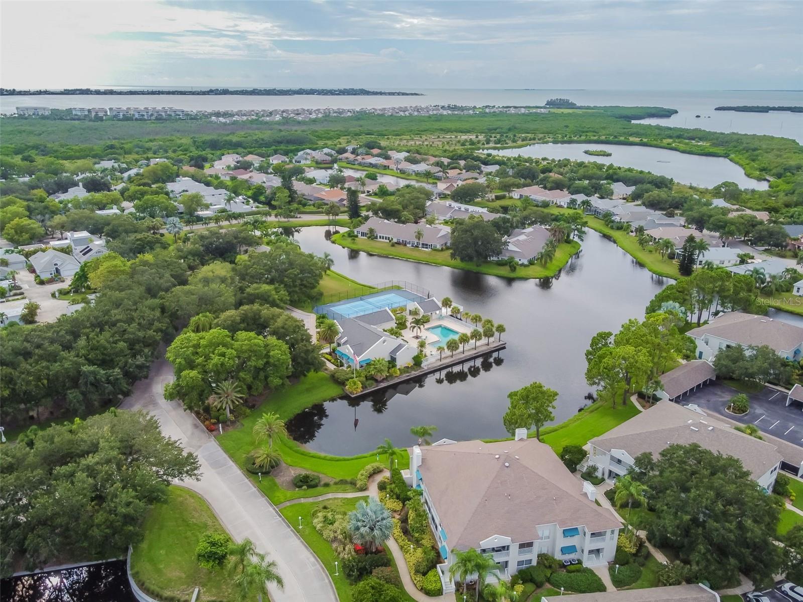 **PRICE REDUCTION, MOTIVATED SELLERS**
Coastal Living at Its Finest! Just 2 miles from the award-winning white sandy beaches of Anna Maria Island, this stunning, fully furnished first-floor condo in Perico Island is the perfect coastal getaway in sunny Bradenton, Florida. Thoughtfully transformed, this beautiful 2-bedroom, 2-bathroom home showcases quality furnishings throughout, stainless steel appliances, granite countertops, and the convenience of an in-unit washer and dryer. Recent upgrades include a brand-new HVAC system and hot water heater, ensuring modern comfort and efficiency.

Step inside to find a bright, airy open layout filled with natural light from numerous hurricane-impact windows. The well-appointed kitchen offers a cozy eat-in area and a separate dining room—perfect for entertaining or relaxed meals at home. Both bedrooms are generously sized, with the primary suite featuring a private ensuite bath for added comfort and privacy.

Perico Island offers resort-style amenities, including a newly renovated clubhouse with a fitness center, billiards room, library, and saunas, plus a heated pool and tennis/pickleball courts. Surrounded by the scenic beauty of Robinson, Perico, and Neal Preserves, this prime location is ideal for outdoor enthusiasts and beach lovers alike. Enjoy boating, fishing, golfing, shopping, and dining—or simply unwind on the pristine shores of Anna Maria Island, just minutes away over the drawbridge.

Whether you’re seeking a turnkey seasonal retreat or a year-round coastal haven, this exceptional condo is ready for you to move in and start living the best of Florida’s coastal lifestyle today!