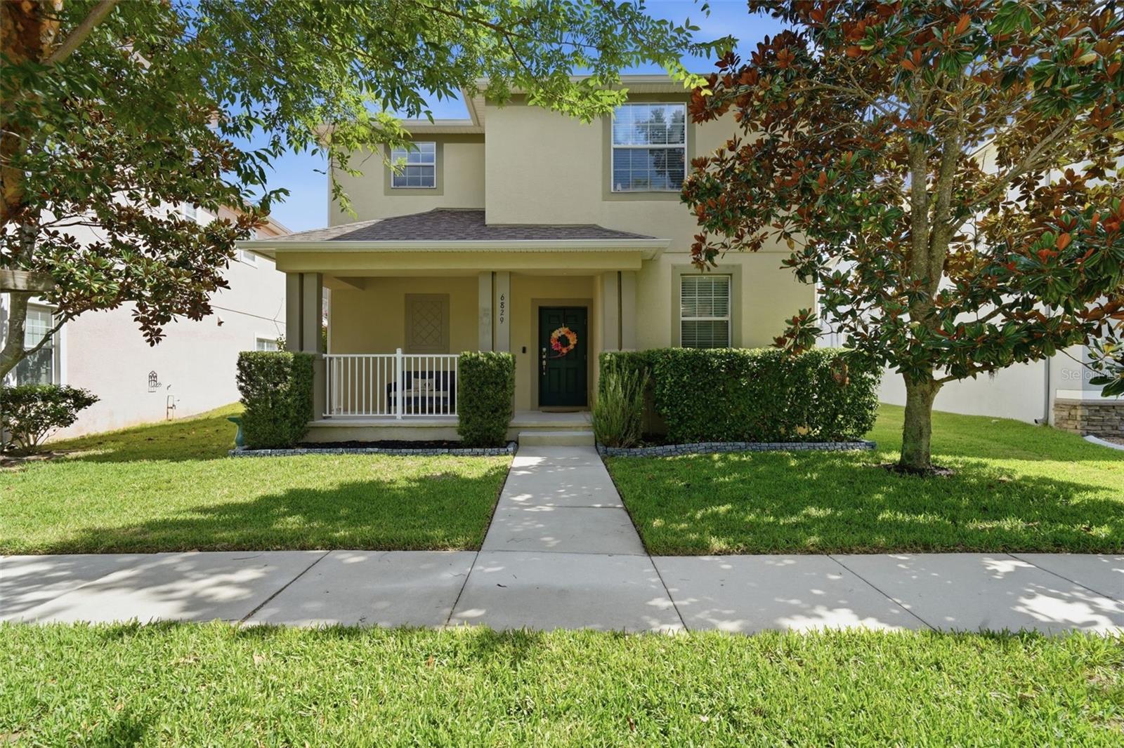 1 Year Free Home Warranty gifted to Buyer, curtesy of SOVERA Realty. Welcome home to this meticulously maintained 3-bedroom, 2.5-bath gem, ideally situated on a mature, tree-lined street directly across from Sundrop Park — offering a playground and expansive green space just steps from your front porch. A charming rocking-chair front porch sets a warm, welcoming tone, while a newly installed 6-foot privacy fence (2023) adds both outdoor enjoyment and peace of mind.

Step inside to a bright, open floor plan featuring tile flooring and fresh neutral paint completed throughout the first floor in 2025. The main level offers a formal dining room, a convenient half bath, a spacious living area, and an inviting kitchen complete with GE appliances, 42-inch wood cabinetry, granite countertops, and a cozy dinette area. The interior laundry room adds everyday convenience with valuable under-stair storage, and the water heater was replaced in 2023 for added peace of mind.

Upstairs, all bedrooms are thoughtfully positioned for privacy. The spacious owner's suite boasts an ensuite bath with a dual-sink vanity, separate shower, and relaxing garden tub. Two secondary bedrooms share a convenient Jack-and-Jill-style bath, while a generous loft offers flexible space — perfect as a playroom, home office, homework station, media room, or quiet retreat.

Additional highlights include a two-car rear-entry garage with alley access, overhead storage, and a garage door opener installed in 2024. Ideally located near Harmony Community School, this home delivers everyday functionality alongside an unbeatable neighborhood lifestyle.

Harmony residents enjoy access to outstanding community amenities, including two community pools, a splash pad, parks, playgrounds, picnic areas, sports courts, and miles of scenic walking trails. Gather at the vibrant town square for community events or head to Buck Lake to enjoy the fishing pier and resident community boats. Harmony Preserve Golf Course is also just minutes away.

Come experience the comfort, convenience, and active Florida lifestyle that make Harmony one of the area's most sought-after places to call home.