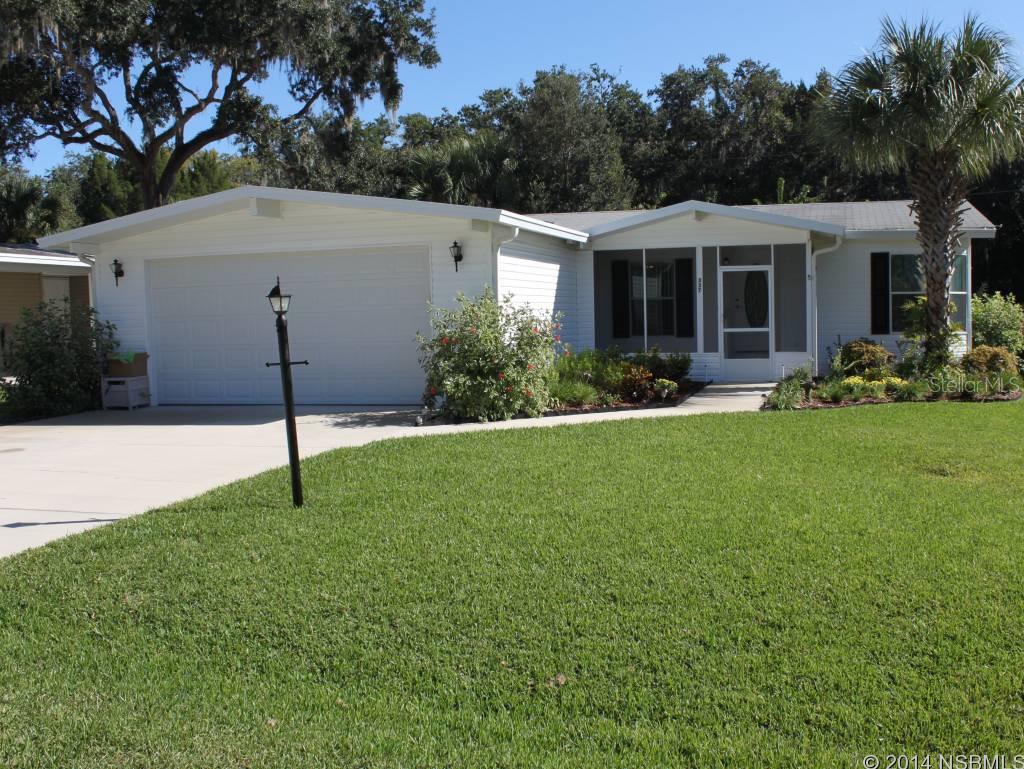 This exquisite two bedroom two bath home is located in Lighthouse Cove. This home features a charming front porch, screened patio, utility room and a 2 car finished garage. The home is freshly painted with new tile floors throughout, open concept with a custom designed kitchen, Kraftmaid cabinets, Silestone countertops and breakfast bar. Relax on your enclosed patio while watching the birds and squirrels. This home is beautifully landscaped, includes a timed irrigation system and is a short walk to the Community fishing pier and small boat launch. Lighthouse Cove is a riverside gated community nested on a beautiful parcel of land in one of the world's premier fishing areas on the Indian River Intracoastal Waterway. Lighthouse Cove features a clubhouse, heated swimming pool, fishing pier, picnic pavilions, a boat dock with boat slips and a small boat launching area. Oak Hill was recently named number five of the top ten places to buy a vacation home for outdoor adventures. This is a beautifully located home. A must see. All measurements are approximate. ;Water: City