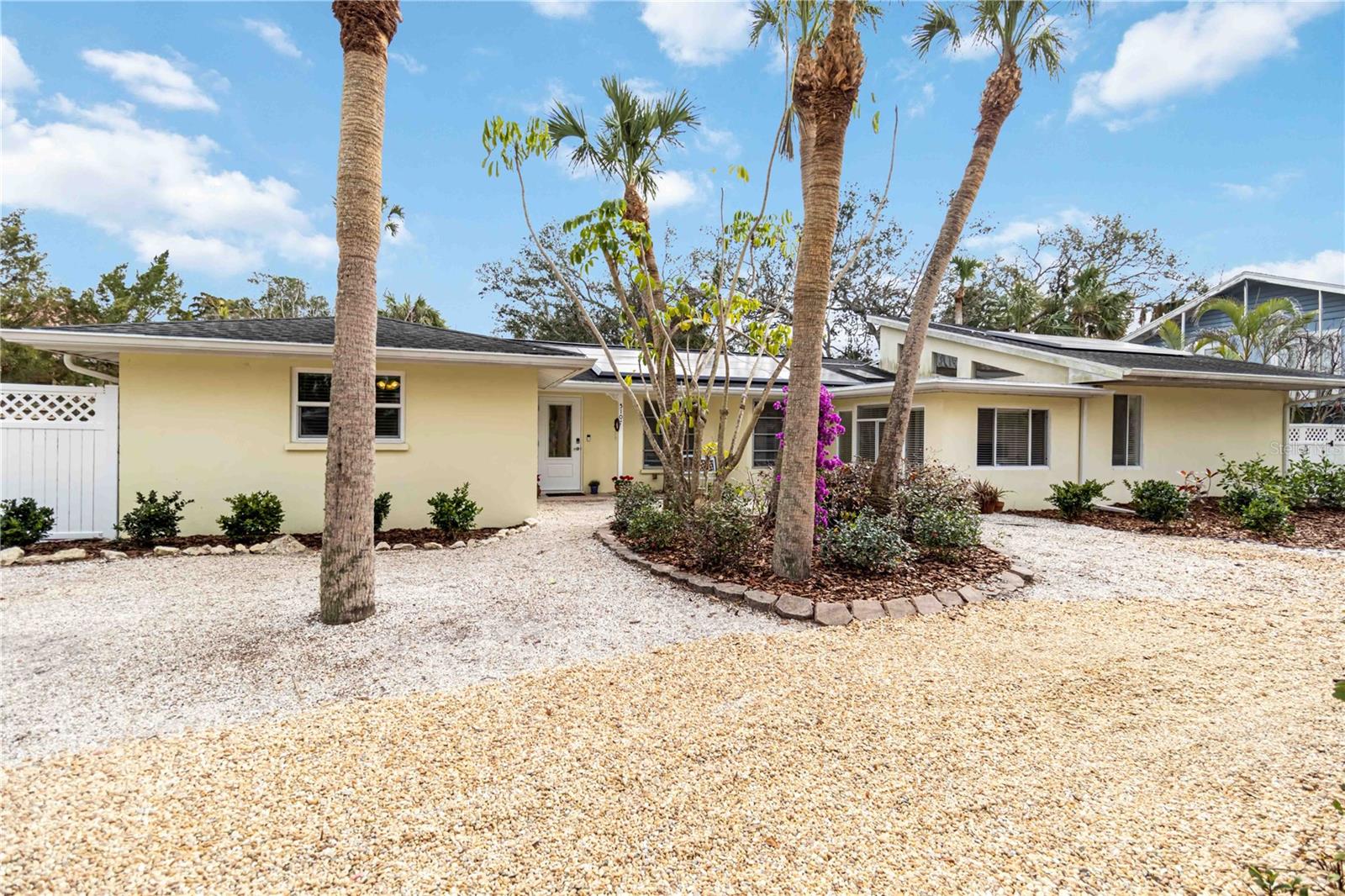One or more photo(s) has been virtually staged. Welcome to this beautifully renovated ranch-style home, ideally located within minutes to the #1 beach in the United States—Siesta Key Beach! Set on an oversized lot, this property offers a private outdoor oasis with a relaxing pool surrounded by lush, mature landscaping, perfect for entertaining or unwinding after a day at the beach. Designed for effortless single-level living, this home blends modern updates with timeless coastal style, making it perfect as a full-time residence, vacation getaway, or investment opportunity. Offering 3 spacious bedrooms + den and 2.5 updated baths, the thoughtfully designed floor plan delivers both comfort and functionality. Light-filled living areas flow seamlessly throughout the home, complemented by a stylishly updated kitchen and baths featuring quality finishes. A detached garage adds valuable convenience and storage. Recent upgrades include a 2024 Tesla solar system with two Powerwall's, providing energy efficiency, backup power, and long-term savings. Additional improvements include two HVAC systems for optimal climate control and a new water heater for added peace of mind. Enjoy morning strolls to the world-renowned quartz sands of Siesta Key Beach, evenings dining at Siesta Village, and the ease of move-in-ready coastal living in one of the most sought-after locations. Expertly restored terrazzo flooring  throughout the main living areas and bedrooms, giving the home a new fresh look. All information should be independently verified by buyer's and buyers agent.