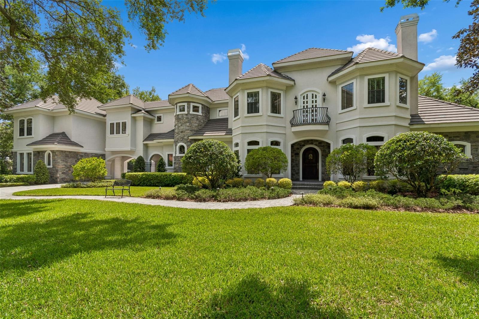 One or more photo(s) has been virtually staged. Located within Avila, this custom residence offers 4 bedrooms, 4 full baths, 2 half baths, 6,062 square feet of living space, and a 5-car garage on an approximately 0.82-acre homesite. Built in 2000, the floor plan includes a den/library/office, family room, foyer, game room, and loft, along with solid wood cabinetry, stone counters, built-ins and cathedral, tray, and vaulted ceilings, walk-in closets, a wet bar, and two gas fireplaces. The kitchen is appointed with built-in appliances, and the outdoor living areas are designed for entertaining with French doors, screened deck/patio/porch spaces, an in-ground screen-enclosed pool, outdoor grill, mature landscaping, oak trees, portico, and motor court. A wine cellar and private homesite add to the property’s appeal. 

Set on a private corner lot in the exclusive Avila community, this custom estate is surrounded by mature landscaping and majestic trees, creating a beautiful sense of privacy and arrival. Offering 4 bedrooms, 4 full baths, 2 half baths, 6,062 square feet of living space, and a 5-car garage, the home features an exceptional layout with a den/library/office, family room, game room, loft, and inviting entertaining spaces throughout. Interior highlights include built-in features, solid wood cabinetry, stone counters, cathedral, tray, and vaulted ceilings, walk-in closets, a wet bar, and two gas fireplaces. The outdoor living experience is equally impressive with French doors opening to screened deck, patio, and porch areas, an in-ground screen-enclosed pool, outdoor grill, irrigation system, and portico. Located within guard-gated Avila, residents enjoy a premier lifestyle with 24/7 gatehouse staffing and patrols, plus community amenities including a playground, park, running/walking path, lighted walking track, soccer field, basketball court, pickleball courts, pavilion, and enclosed dog park.
