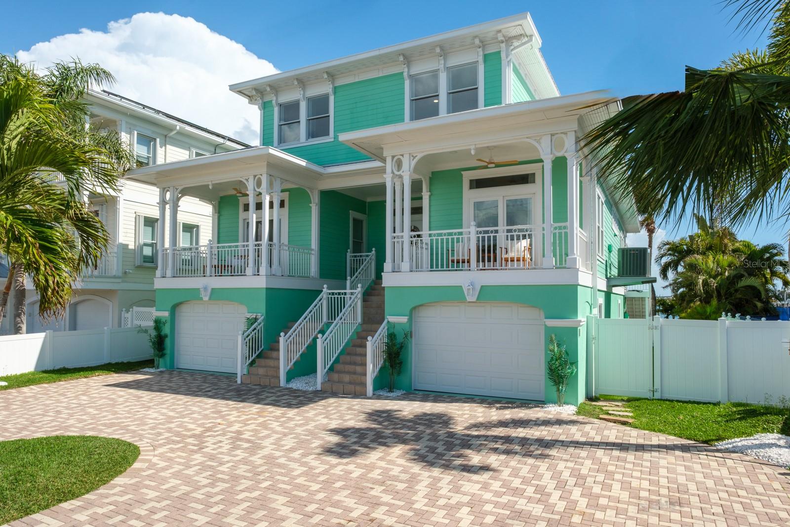 Under contract-accepting backup offers. SURROUND YOURSELF IN PARADISE AT THIS ONE-OF-A-KIND KEY WEST–STYLE WATERFRONT RETREAT. Wake up to breathtaking views of Boca Ciega Bay, enjoy deep boating water with unobstructed access to the Gulf of Mexico, and take a short stroll to the sugar-white sands of St. Pete Beach. Custom built in 2004 to a 14’ elevation with superior construction quality, this tropical residence just got a BRAND-NEW RENOVATION throughout the entire home, and you will love it! 

Designed for both coastal elegance and entertainment, this home features 4 spacious en-suite bedrooms, 5.5 bathrooms, a stylish sitting room/library, an elevator and a bonus media/game space spanning over 3,800 square feet of refined modern living. There’s plenty of space for cars too with 2 garages holding 4 cars total plus room for toys. Add an additional 1,200 square feet of covered balconies and patios, and you’ll enjoy more than 5,000 square feet of covered living space—ideal for embracing the Florida lifestyle year-round.

The bright, open-concept interior showcases 9’ ceilings, expansive floor-to-ceiling windows and sliders, and a seamless indoor-outdoor flow that floods the home with natural light, spectacular water views and an unbeatable bay breeze. The chef’s kitchen is a focal point showcasing a new remodel with stunning solid white cabinetry, striking Quartz countertops, new S.S. appliances with a 6-burner stove and oven/microwave combo, center prep island, and a generous high-top bar—perfect for hosting friends, family and events. 

So many amazing new updates have been made including luxury vinyl flooring throughout, custom accent walls, redesigned modern fireplace, new LED lighting and fixtures, all updated bathrooms, new interior paint and much more. Thoughtful custom details are found throughout, including coffered ceilings, crown molding, plantation shutters, custom wallpaper accents and elevator access to all levels. 

Your new primary suite received a luxurious spa-like remodel too! As you enter through French doors, you can’t help but notice the beautiful Herringbone pattern luxury vinyl floors and gorgeous water views. The bathroom was completely redesigned with a stand-alone tub and large walk-in shower. The walk-in closet is spacious and has built-in shelving. Step out on the private balcony for perfect sunset evenings. Each guest bedroom is a spacious, private en-suite retreat with updated baths and water views. 

Step outside to your own resort-style waterfront oasis. Enjoy a new Trex dock with a 30,000-pound boat lift, providing effortless access to the Gulf—perfect for boating enthusiasts. Outdoor living is elevated with expansive balconies, an outdoor kitchen, built-in fire pit, heated pool and spa, approximately 750 square feet of turfed space, and ample room for lounging, dining, and entertaining against the spectacular bay backdrop.

This exceptional home delivers the ultimate coastal lifestyle—just a short walk to the beach, restaurants, shops, and entertainment. Conveniently located only 15 minutes to downtown St. Petersburg and 30 minutes to Tampa International Airport, this is truly the best of both luxury and location. This is more than a home - it’s a lifestyle! Your waterfront paradise awaits.