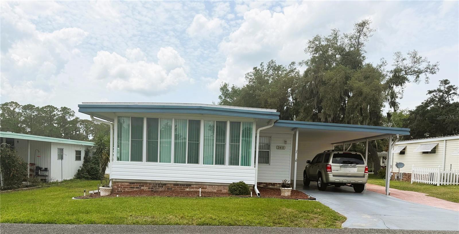 Beautifully furnished 2-bedroom, 2-bath home that is exceptionally clean and well maintained! This move-in ready property features a new roof in 2021 and a new A/C unit in 2024 with a 10-year warranty for added peace of mind. A generator transfer switch is integrated into the home’s electrical system, allowing for easy connection of a generator to power the home during outages. Both bedrooms feature built-in closets along with spacious walk-in closets. The updated kitchen includes newer countertops and a double pantry providing plenty of storage space. French doors lead into the bright and inviting Florida room, perfect for relaxing or entertaining. Outside, enjoy the large golf cart driveway that wraps around to the back of the home, offering ample parking and easy access. This charming home has been lovingly cared for and is ready for its new owners!

Hawthorne at Leesburg is a vibrant 55+ community that blends comfort, convenience, and affordability. For just $397 a month, residents enjoy a maintenance-free lifestyle that includes water, sewer, lawn care, emergency services, and access to a wealth of resort-style amenities plus secure RV and boat storage. The expansive clubhouse is the social hub of the community, offering over 100 organized activities, a welcoming lounge, card rooms, billiards, a fitness center, a library, and a fine arts studio. A dedicated program coordinator ensures there’s always something fun and engaging on the calendar. For those who love the water, the private marina offers more than 120 boat slips with direct access to the beautiful Harris Chain of Lakes. Safety and peace of mind come standard, thanks to a 24/7 on-site team of state-certified firefighter/EMTs, emergency vehicles, and in-home emergency response buttons. Surrounded by natural beauty, the community features scenic walking trails, serene lake views, and plenty of opportunities for fishing and boating. The golf cart-friendly streets make it easy to explore nearby shopping, dining, and medical facilities. With a sparkling pool, endless recreational options, and a warm, welcoming atmosphere, Hawthorne at Leesburg isn’t just a place to live — it’s a lifestyle. Schedule your showing today and discover the perfect blend of comfort, community, and convenience.