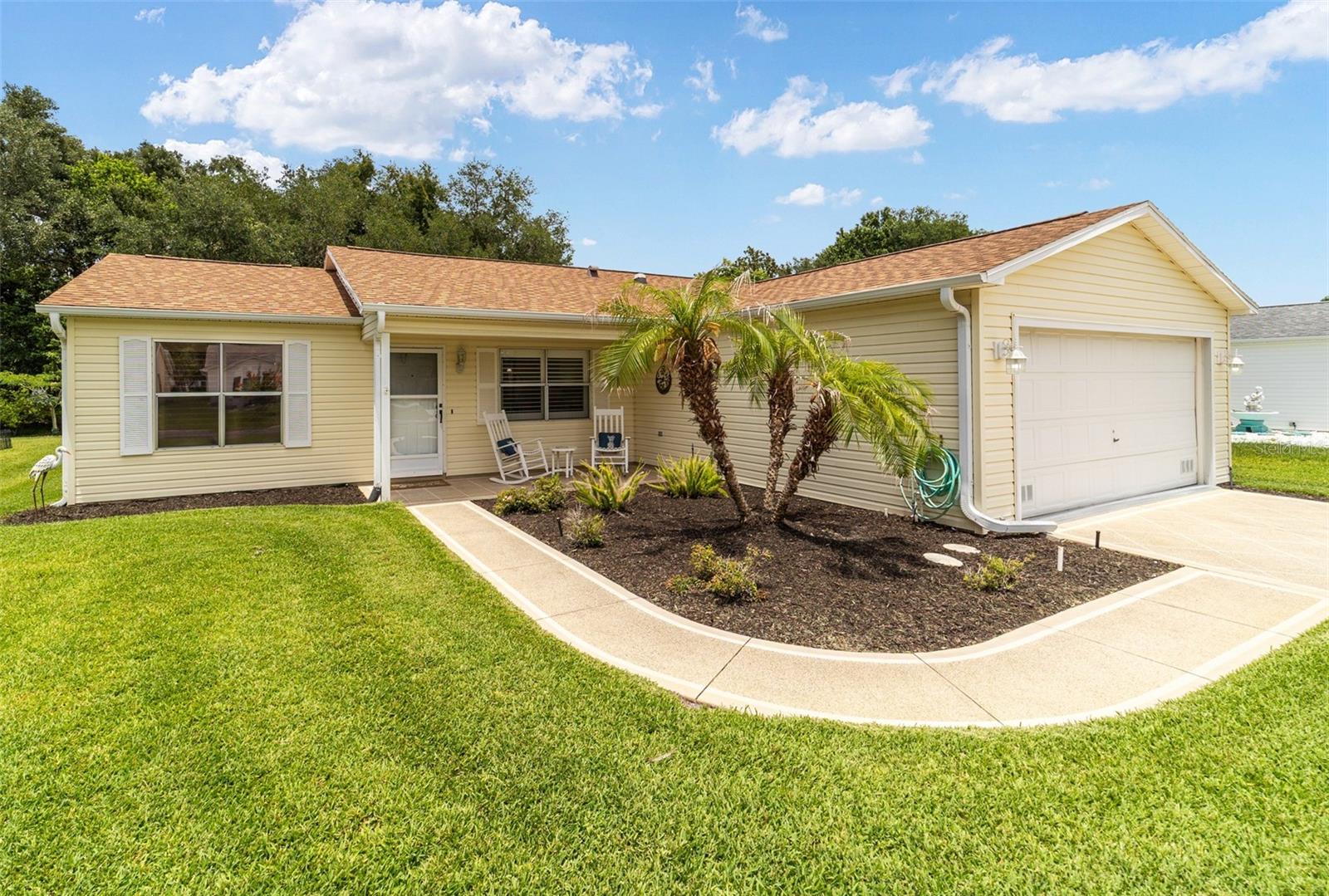 BOND PAID!!!! TURNKEY with GOLF CART INCLUDED!!!! This 2-bedroom, 2-bath Galveston Model PRICED TO SELL!!!! offers one of the features Villages buyers are always searching for—PRIVATE WOODED VIEWS and NO KISSING LANAI with a 2-CAR GARAGE!!!  Featuring a NEW ROOF (2024), HVAC (2016), HWH (2018) and an EXPANSIVE GLASS-ENCLOSED LANAI with MINI-SPLIT, this MOVE-IN READY home is ideally located in the Village of Rio Ponderosa, just minutes from both Spanish Springs Town Square and Lake Sumter Landing.
The inviting curb appeal begins with TROPICAL LANDSCAPING, a DECORATIVE PAINTED DRIVEWAY AND WALKWAY, and a welcoming FRONT PORCH complete with ROCKING CHAIRS. Inside, you'll find an OPEN-CONCEPT FLOOR PLAN with laminate flooring throughout the main living areas, PLANTATION SHUTTERS, and abundant natural light.
The kitchen features STAINLESS STEEL APPLIANCES (2019), a SOLAR TUBE, ample cabinetry, and a spacious CENTER ISLAND with COUNTER-HEIGHT SEATING, making it ideal for both everyday living and entertaining.
One of the standout features of this home is the BEAUTIFUL GLASS-ENCLOSED LANAI with ATTRACTIVE TILE PLANK FLOORING. Surrounded by windows and overlooking PEACEFUL WOODED VIEWS, this versatile space adds approximately 300 SQUARE FEET OF ADDITIONAL LIVING AREA and is ideal as a family room, reading room, hobby space, or entertaining area. A MINI-SPLIT provides year-round comfort, while the adjacent patio with GRILL INCLUDED offers the perfect place to enjoy Florida's beautiful weather.
The primary suite features a WALK-IN CLOSET and EN-SUITE BATH with a WALK-IN SHOWER, MAKEUP VANITY, and LINEN STORAGE. The SPLIT-BEDROOM DESIGN provides privacy for guests, with a guest bedroom featuring PLANTATION SHUTTERS and a WALK-IN CLOSET. The guest bath includes PORCELAIN TILE FLOORING and a tub/shower combination.
Additional highlights include a SOLAR TUBE IN THE LAUNDRY ROOM, NEW WASHER & DRYER (2023), EPOXY-COATED GARAGE FLOOR, ATTIC STAIRS, and abundant storage space.
If you've been waiting for a BOND PAID home with PRIVATE WOODED VIEWS, NO KISSING LANAI, MAJOR UPDATES, an EXPANSIVE LANAI, no noand an EXCEPTIONAL CENTRAL LOCATION, this MOVE-IN READY Rio Ponderosa gem is one you won't want to miss.
