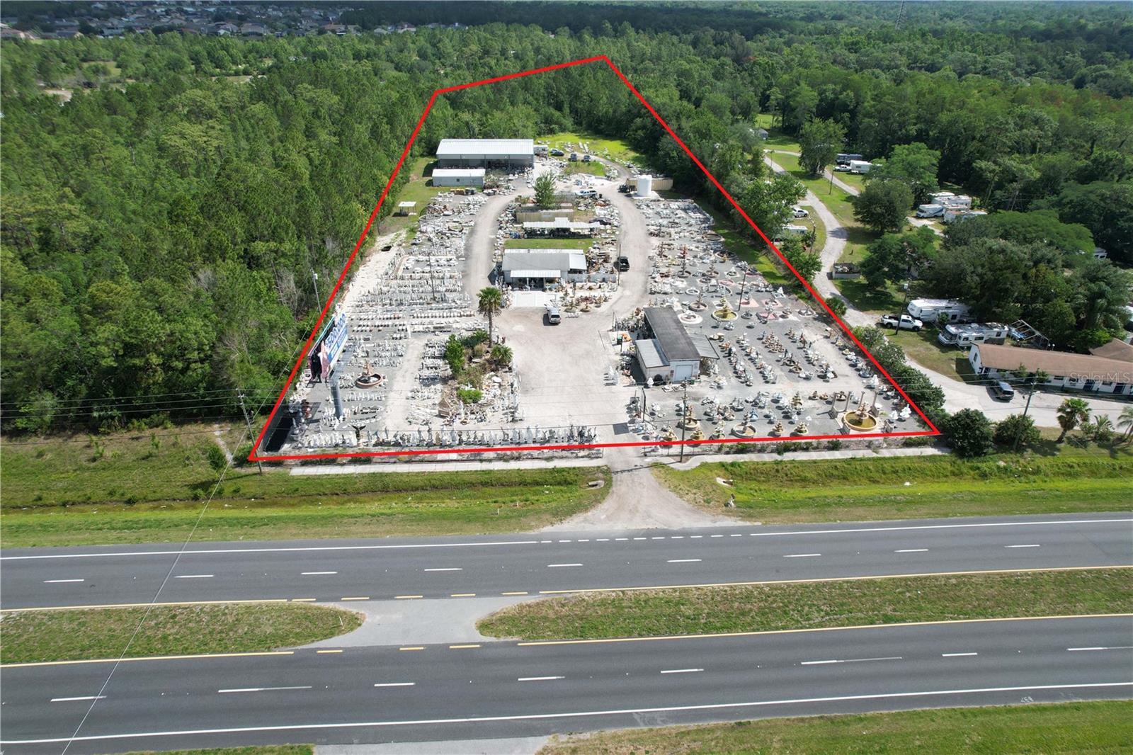 Great Commercial Opportunity 4.78 Acres of C-2 Commercial with 280 Ft of Frontage on busy SR50 with great accessibility going east and west on E Colonial, having a median cut right in the middle of the property. There are two parcels that are being sold together. This property is very unique consisting of 4 buildings on site. A brand new 5400 sq ft Warehouse that was just built 2021 with new septic system. Very nice concrete block 1700 sq ft office. Also, 1746 sq ft storage warehouse and one metal storage building. Endless possibilities with this Commercial property. One metal 30x50 metal storage building on site along with many shipping containers for storage. Located between University of Central FL and NASA's Kennedy Space Center which is booming with growth. Great access to all major highways 408, 417, 528 toll roads and I-95. Call for more information. Income producing Billboard Sign on site! This Property is completely fenced and gated!!!