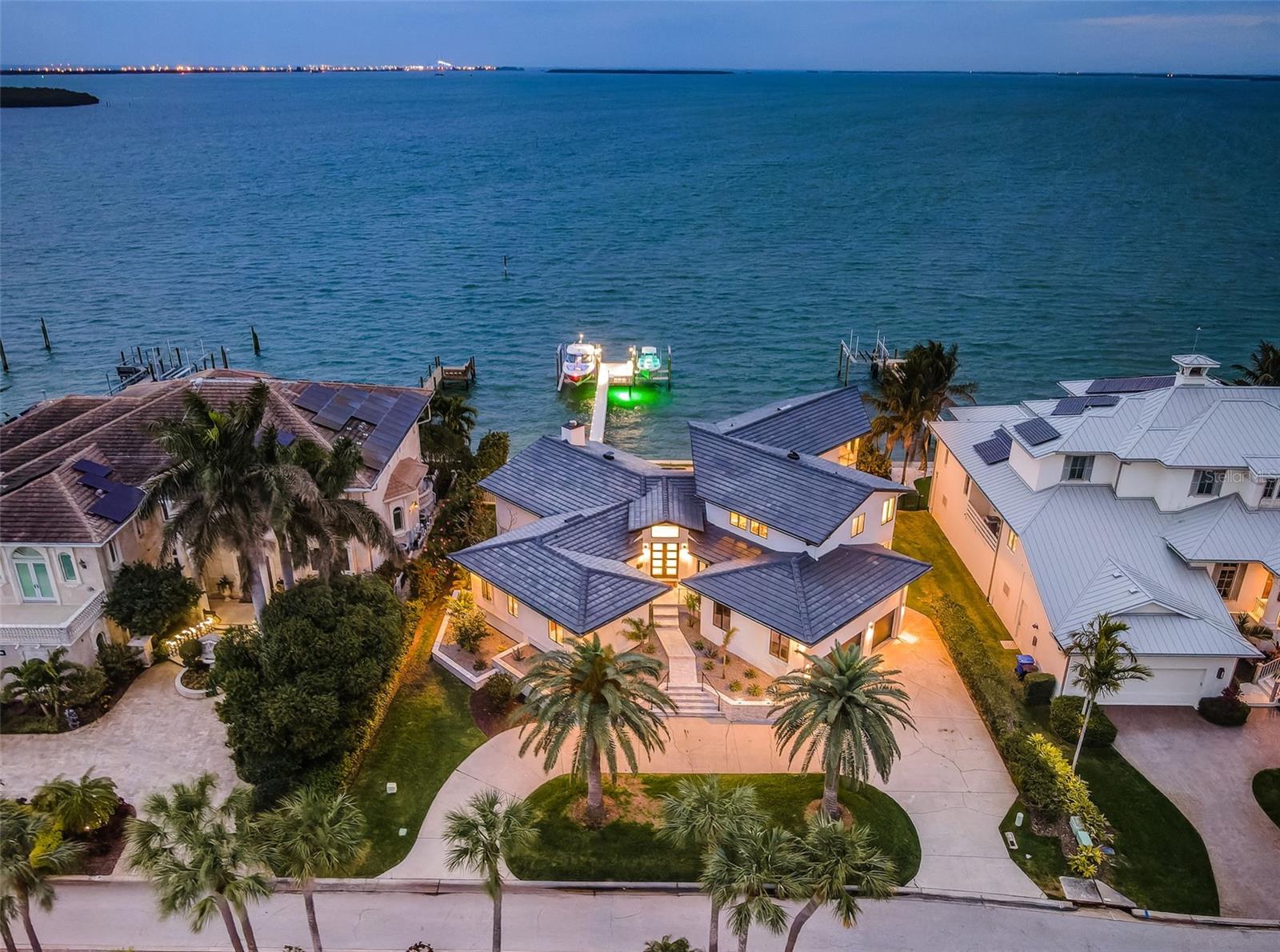 Bayway Isles II. One of the premier gated waterfront communities in all of the Tampa Bay area. Unparalleled water views as far as the eye can see from this architecturally designed contemporary showpiece! In 2022 Strobel Design Build took a majority of the home down to the studs and rebuilt new. The newly designed floor plan captures breathtaking views from almost every angle. Spacious open floor plan with four bedrooms plus office/gym, a mud room, six full baths, one half bath and 4,127sf. of living area. The new kitchen with panoramic water views has top of the line custom cabinetry, island center, quartz counter tops and stainless steel appliances. The upstairs master suite with wrap around balcony offers captivating water views. The master bath has two separate dressing areas, vanities, water closets, and shares a walk in shower. The three additional bedrooms are all en-suite. Other features include: living room with wood burning fireplace, renovated pool bath, multiple decks for year round entertaining with spectacular views, renovated pool, spa, and decking, all new dock and pilings with Trex decking and two new boat lifts with one at 20,000lbs and the other 10,000lbs, new tile roof 2021, four new A/C units, new impact sliders and windows, new flooring and lighting through out, newer seawall, 100ft. of waterfront by 150ft. deep, fresh interior and exterior paint, new landscaping, pavers and so much more. Bayway Isles is a prestigious gated waterfront community conveniently located to the Gulf Beaches, vibrant downtown St. Petersburg and I-275. For the boating enthusiast, easy access to the Gulf of Mexico with no bridges. This contemporary coastal Gem offers the true Florida lifestyle! Be sure to view virtual tour and 3D virtual tour. Floor plans also included.