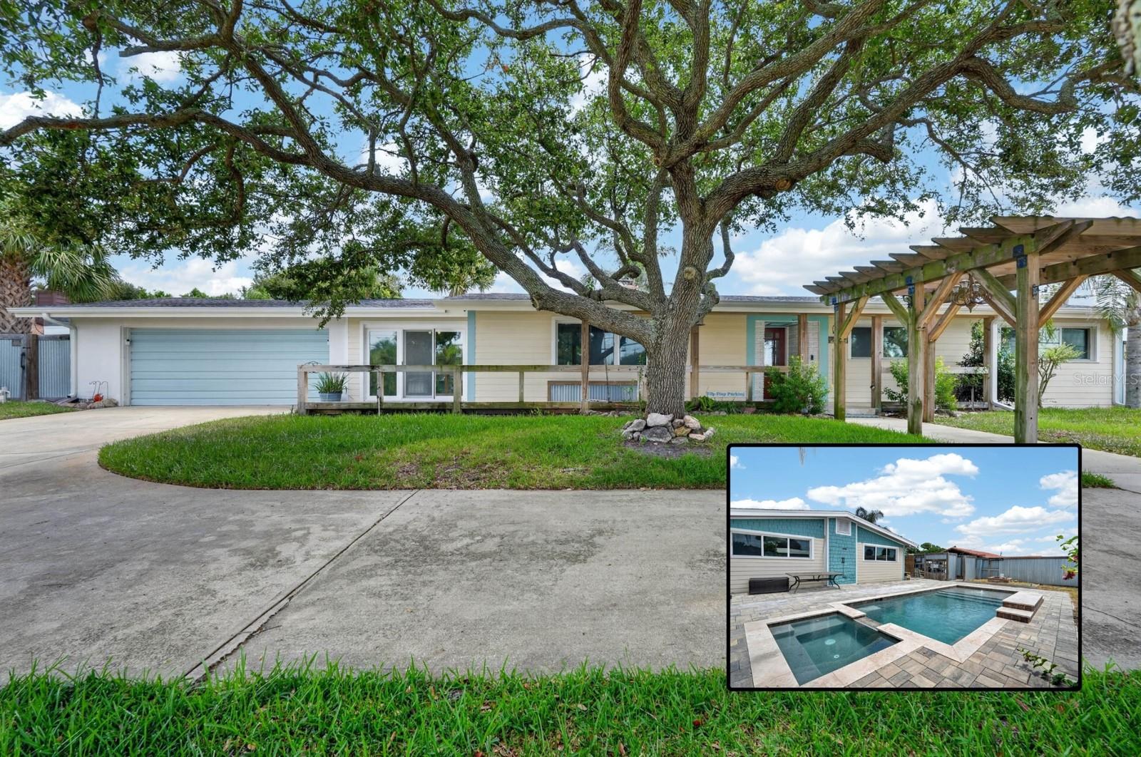 Welcome home to 2071 S Peninsula Dr!
From the moment you arrive, you'll appreciate this home's inviting exterior, mature shade tree, and unique front entry with a long front porch facing toward the west to enjoy sunset. A circular driveway provides plenty of parking and convenient access to the garage/storage area with plenty of room for your motorcycles and hobbies. A pergola walkway adds frames the picture as it leads you toward the front door. Inside, you'll find beautiful hardwood flooring and a fireplace along with a sprawling floorplan convenient for everyday life, entertaining, and extended family style living spaces.
The custom kitchen offers a unique blend of style and functionality with farm chic cabinetry, a spacious center island with butcher-block countertops, built-in wire basket storage, and a farmhouse-style apron-front sink beneath a bright window which is a rare and must see addition to the room's overall flavor. A ceiling-mounted wooden ladder rack adds character, while beautiful tile flooring and modern stainless steel appliances complete the space.
Enjoy the Florida lifestyle in the private backyard with unique nooks galore, from an outdioor wash area, to elevated sitting space to a newer pool installed in 2021 that's surrounded by expansive paver decking, a built-in elevated spa, sun shelf with water bubbler feature, and a raised water feature. The fully fenced backyard creates the perfect space for relaxing or entertaining while maximizing the entire space for a unique, custom feel.
This 4-bedroom, 3.5-bath home offers peace of mind with major updates already completed, including a roof installed in 2019, a replaced primary HVAC system and ductwork from 2019, an updated hot water heater from 2021, and recent updates to the windows, plumbing, and electrical systems.  All that is needed is a new owners finishing touches to make this uniquely yours.
Schedule a private tour today!